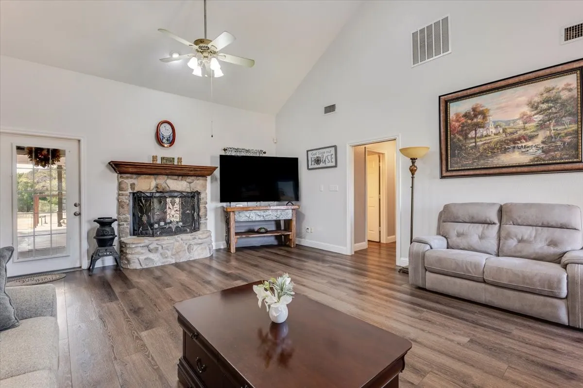 Vaulted ceilings and gorgeous fireplace for a grand living area