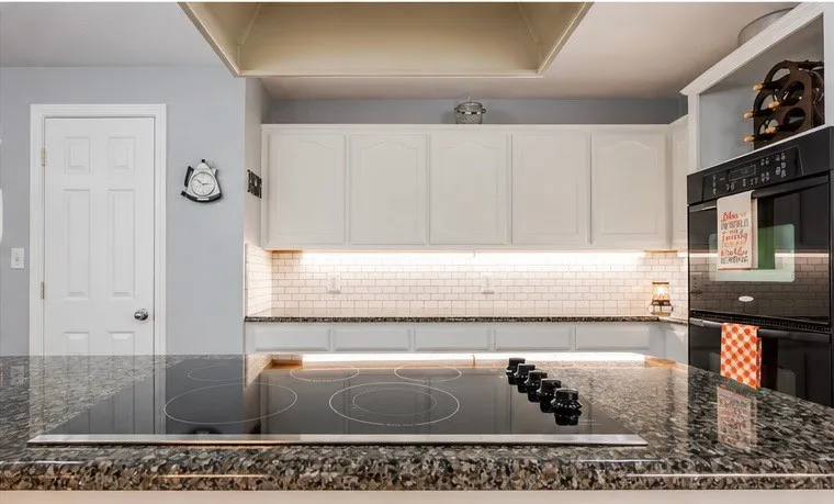 Pantry, double ovens, designer lighting, great counter and storage space