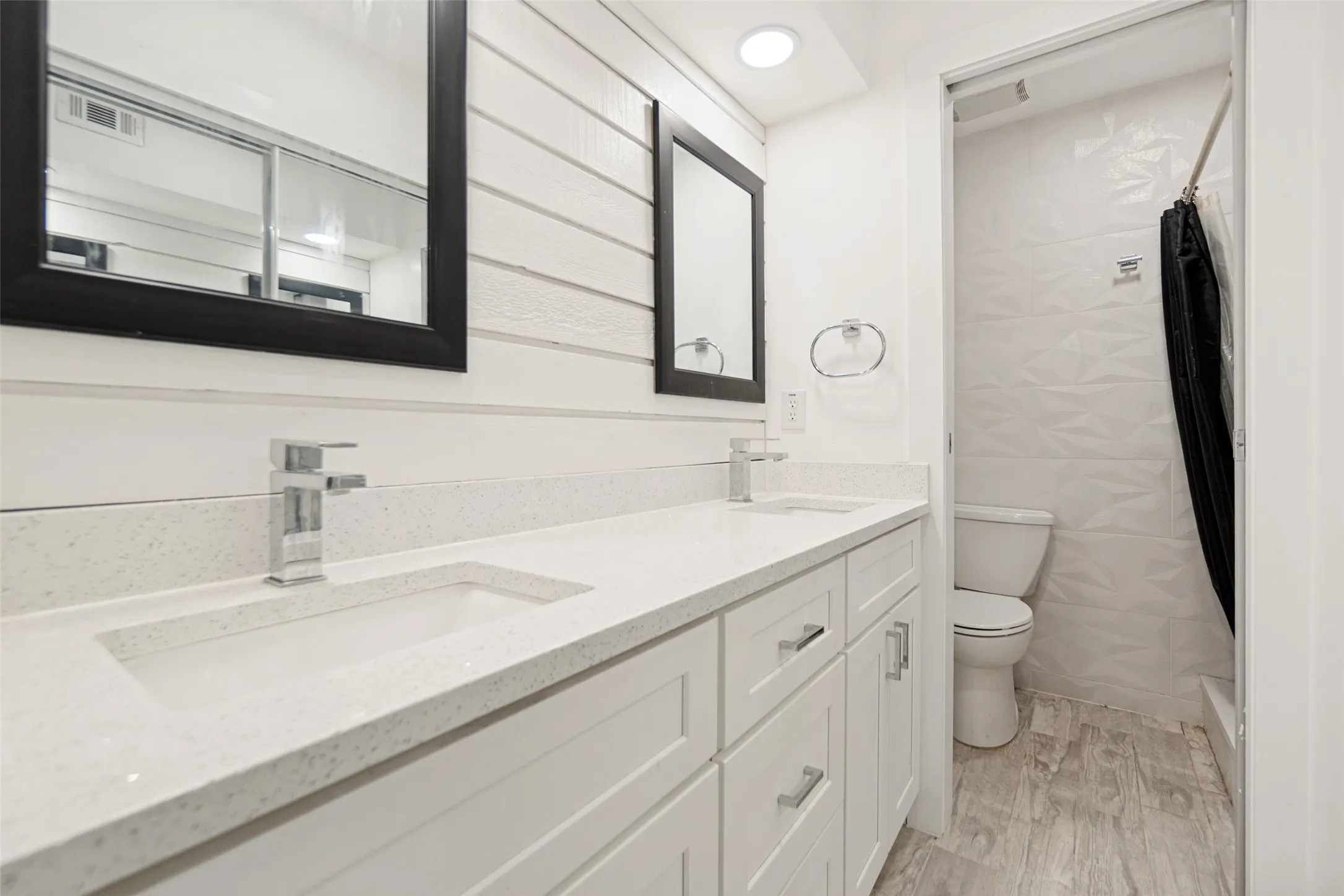 Dual rectangular undermount sinks set in a light-toned countertop