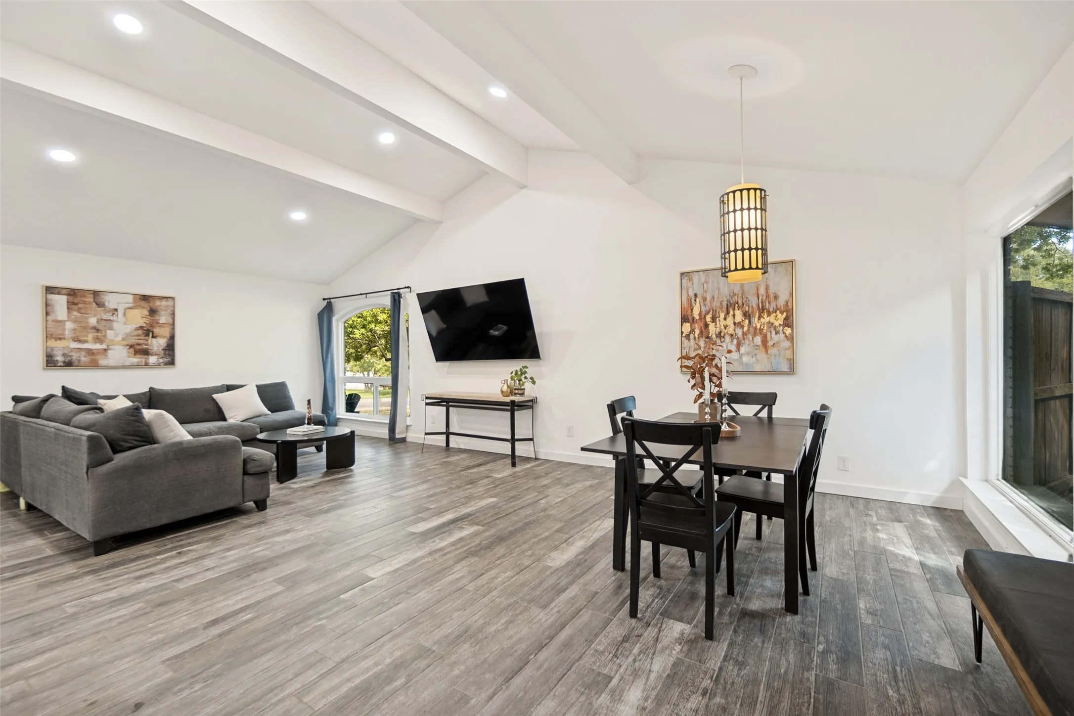 Vaulted ceilings with exposed beams and recessed lighting