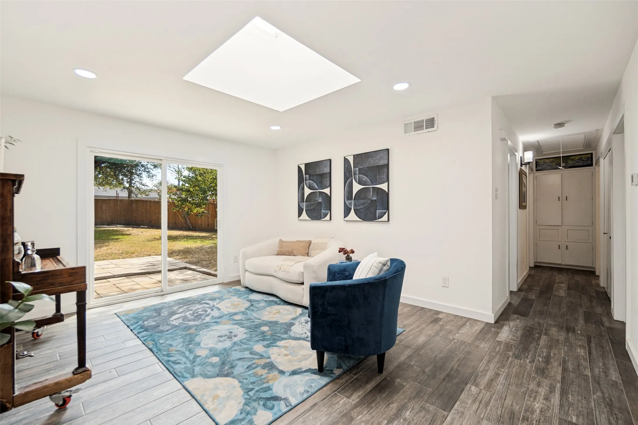 Wood-finish flooring with a skylight and recessed lighting