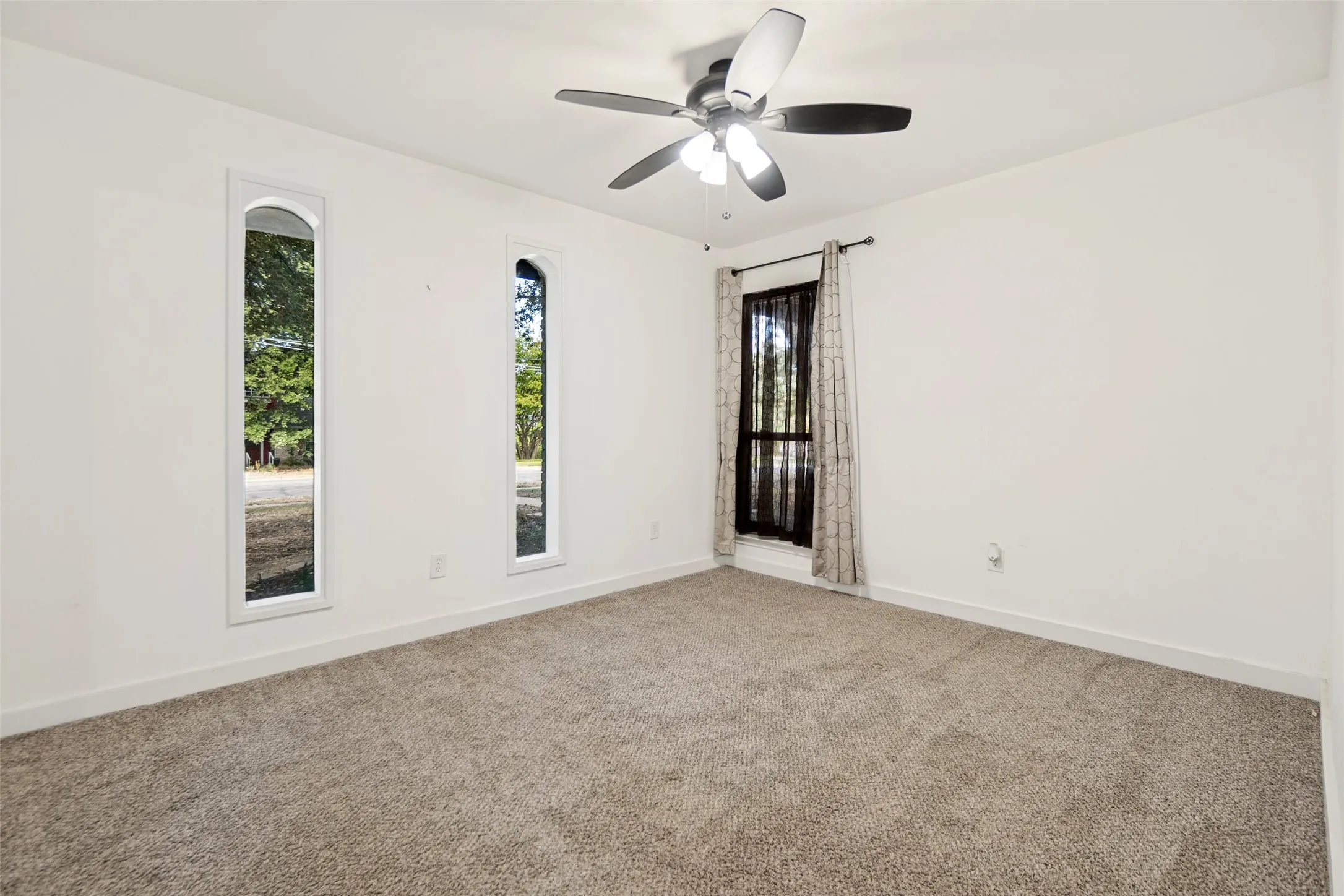 Neutral tone carpeting complements the white walls