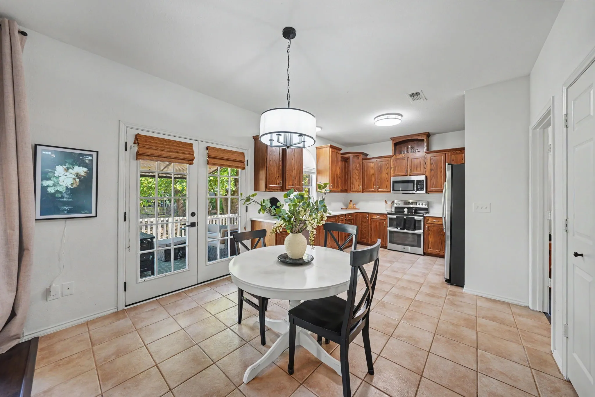 Kitchen featuring wood cabinetry, stainless steel appliances, and white countertops