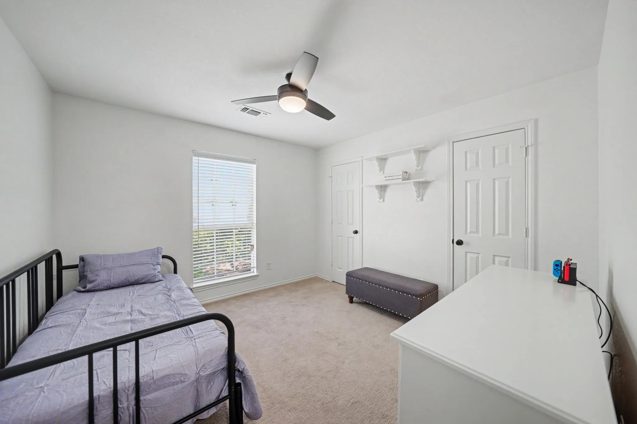 Carpeted flooring complemented by white walls