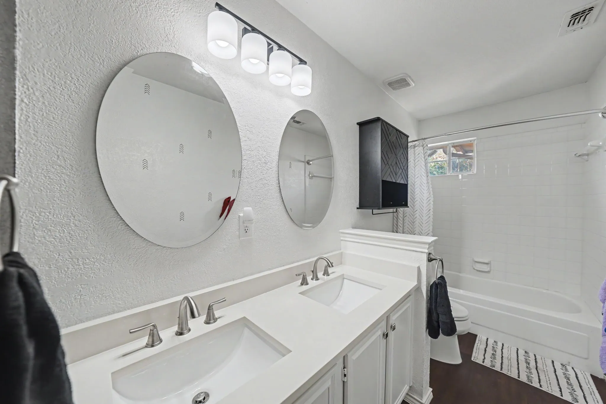 Dual vanity with undermount sinks and chrome fixtures