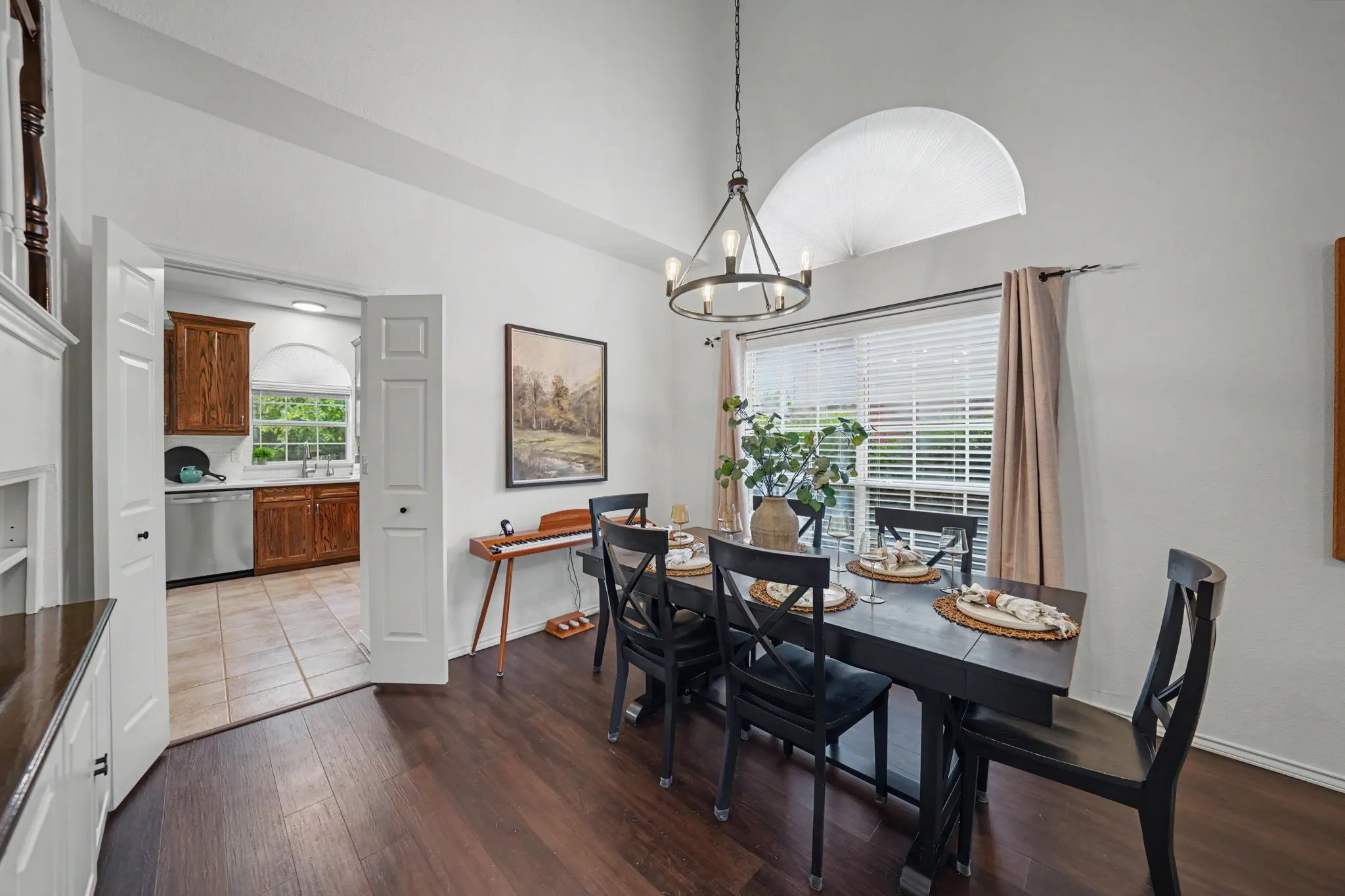 Vaulted ceilings complement the dark wood-finish flooring
