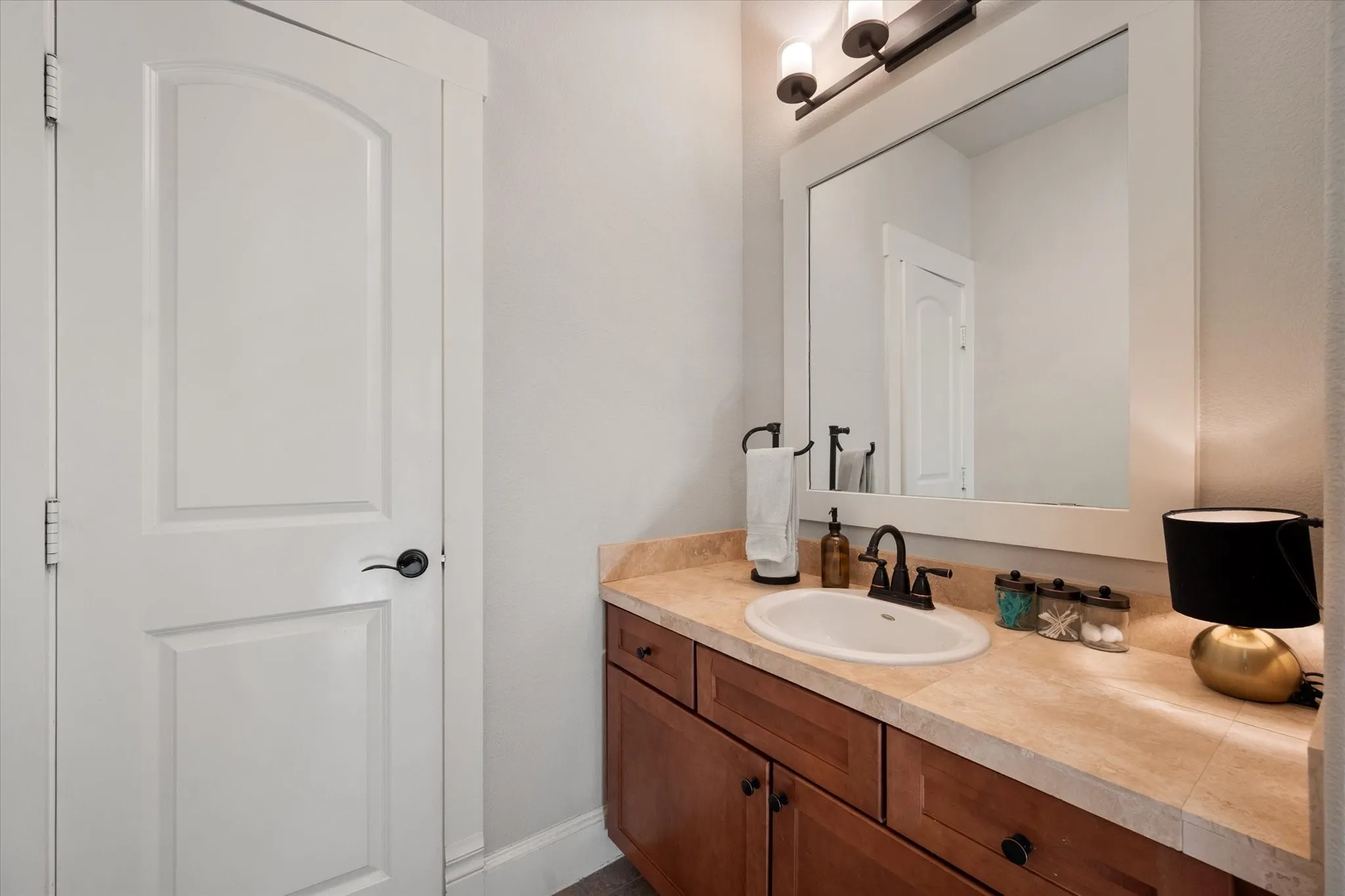 White paneled door with black hardware