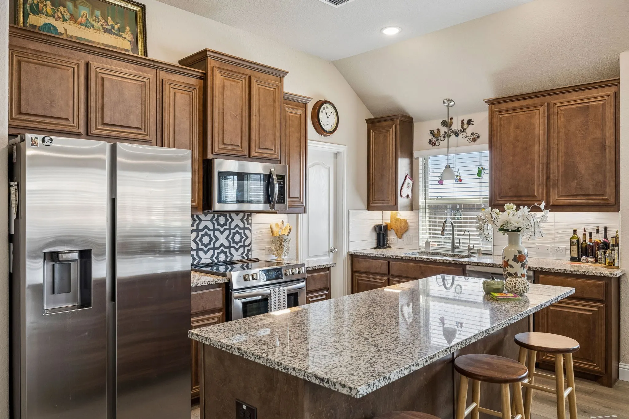 The heart of the home. We love the backsplash and tile feature over the range.