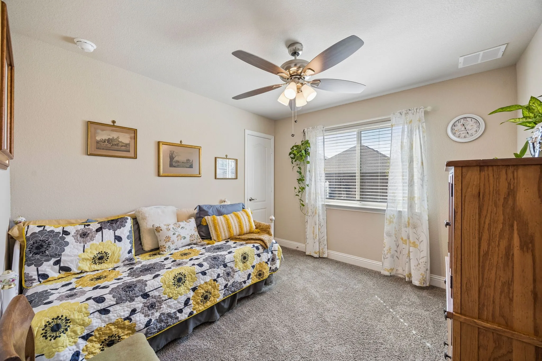 One of two secondary downstairs bedrooms, separate from the primary.