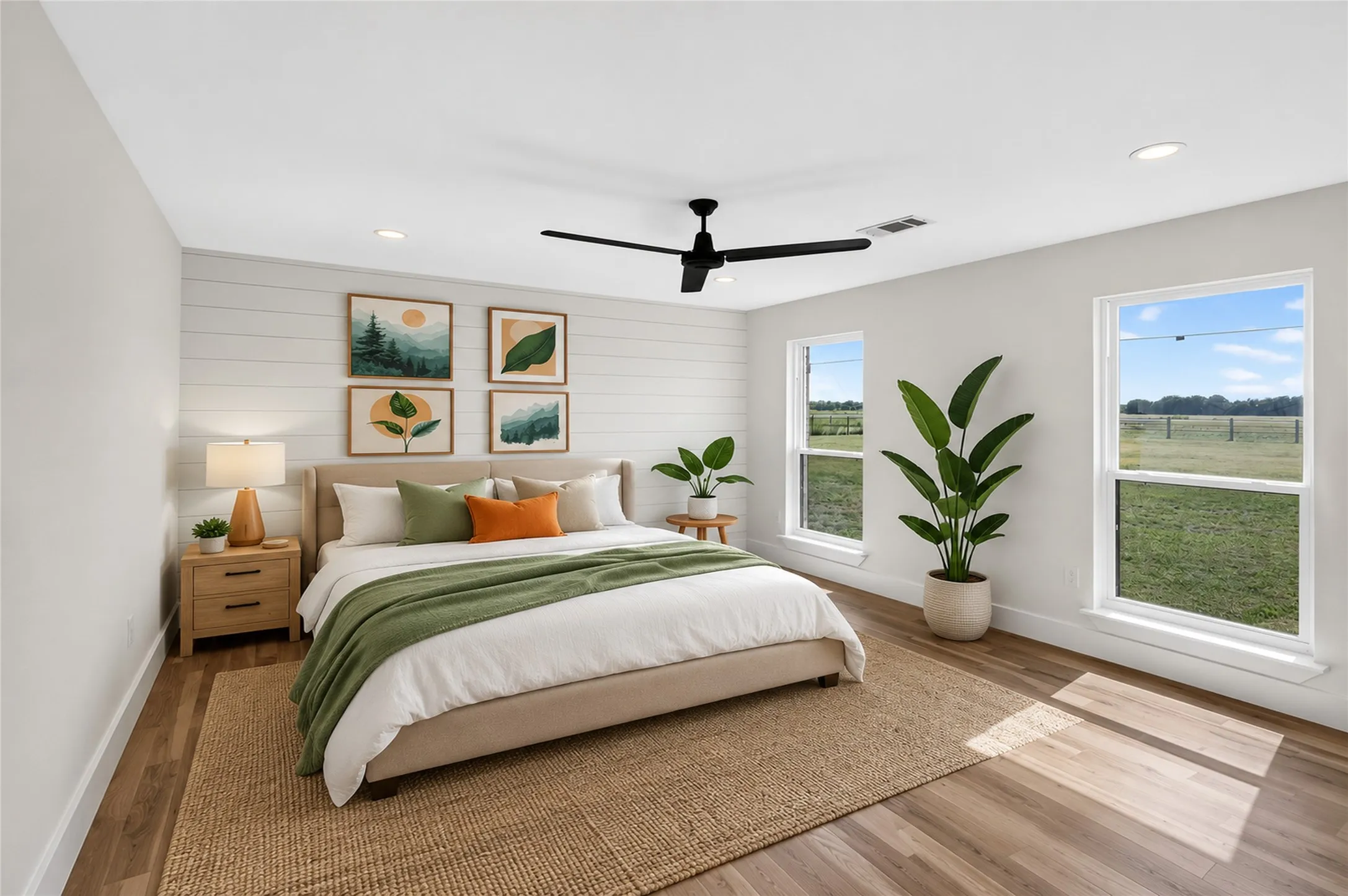 Interior space featuring wood-finish flooring, a white shiplap accent wall, multiple windows, recessed lighting, and a ceiling fan - Virtually Staged