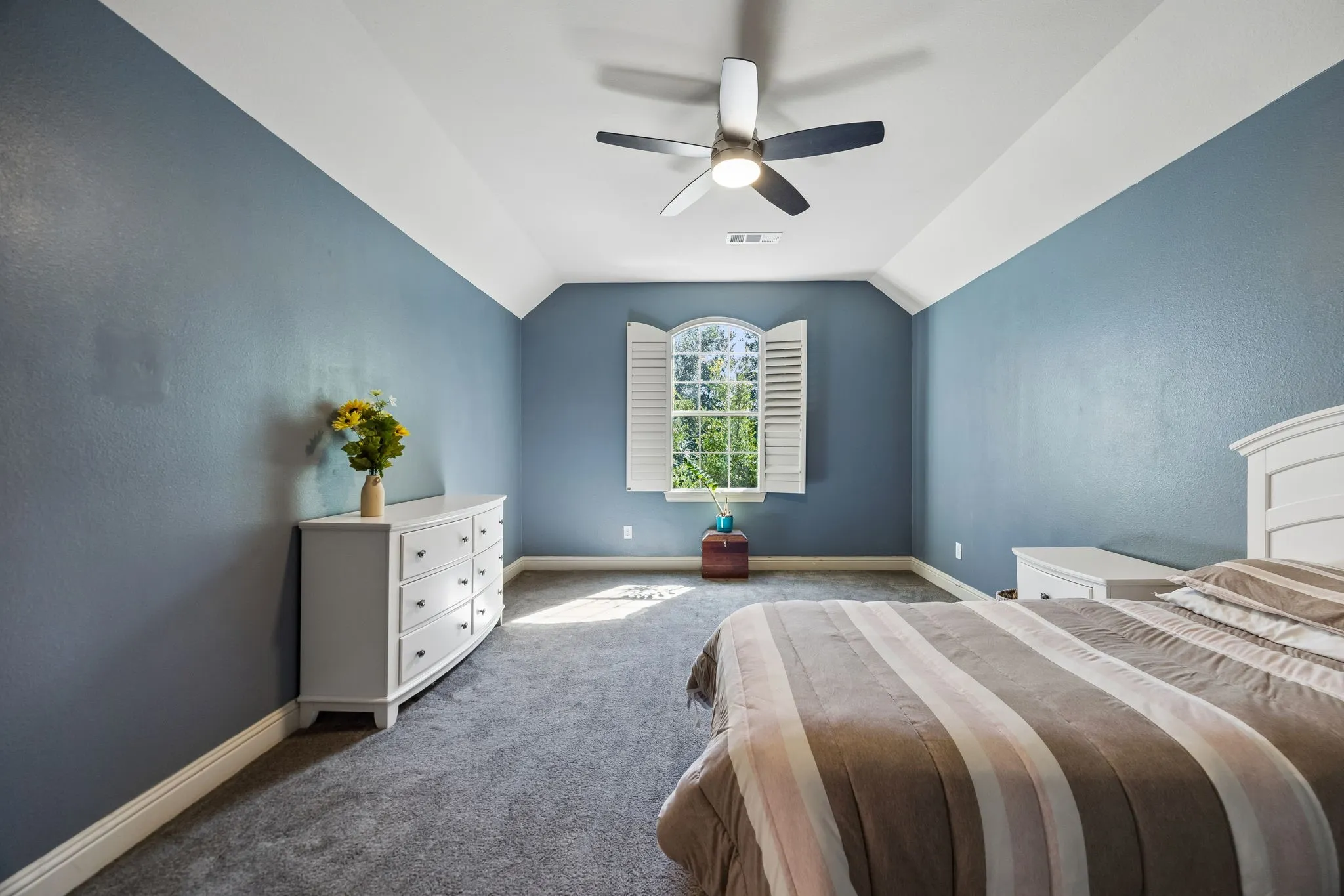 Largest of the 3 secondary bedrooms upstairs with a walk in closet.