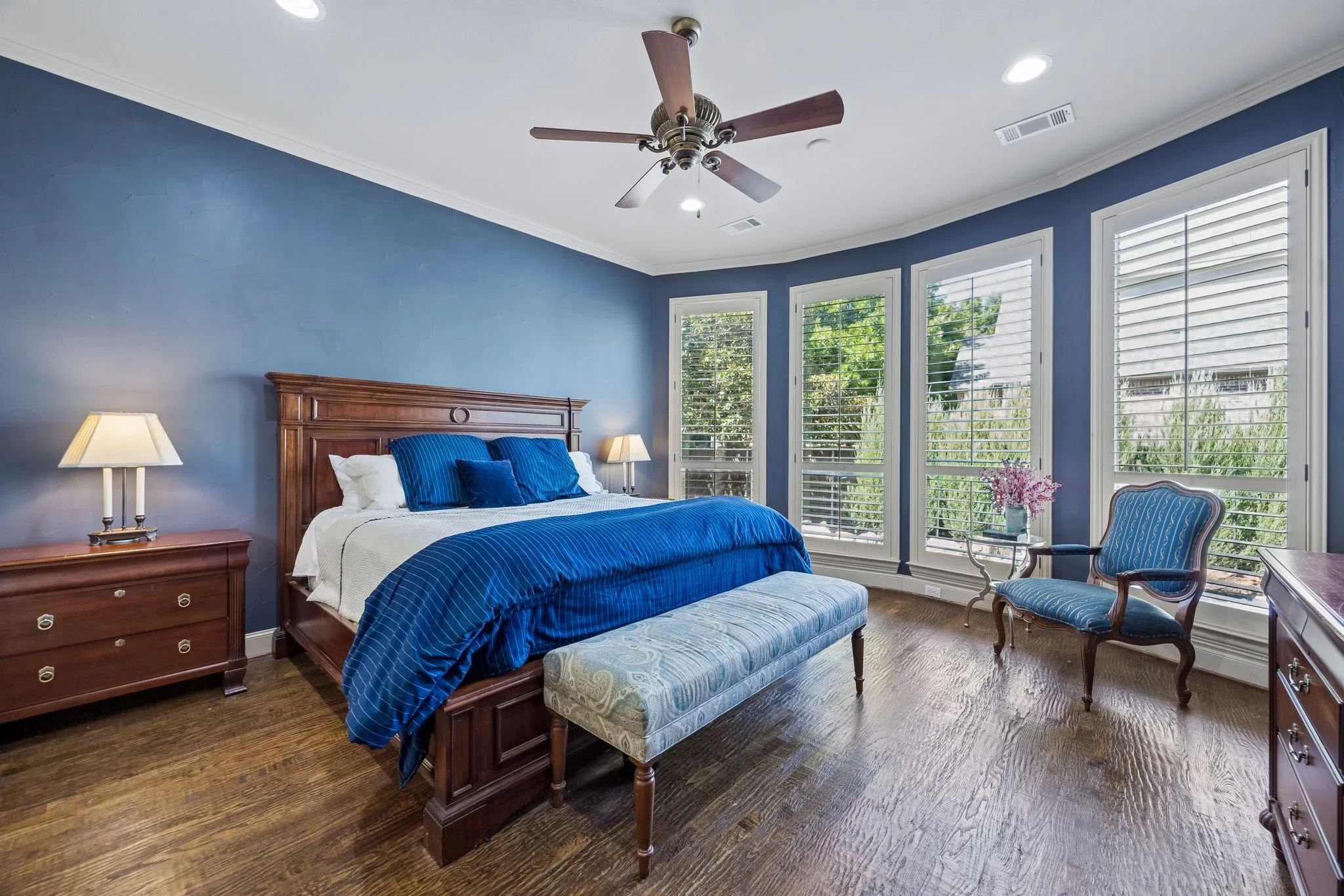 No carpet in primary bedroom! Crown molding, bowed window overlooks the pool.