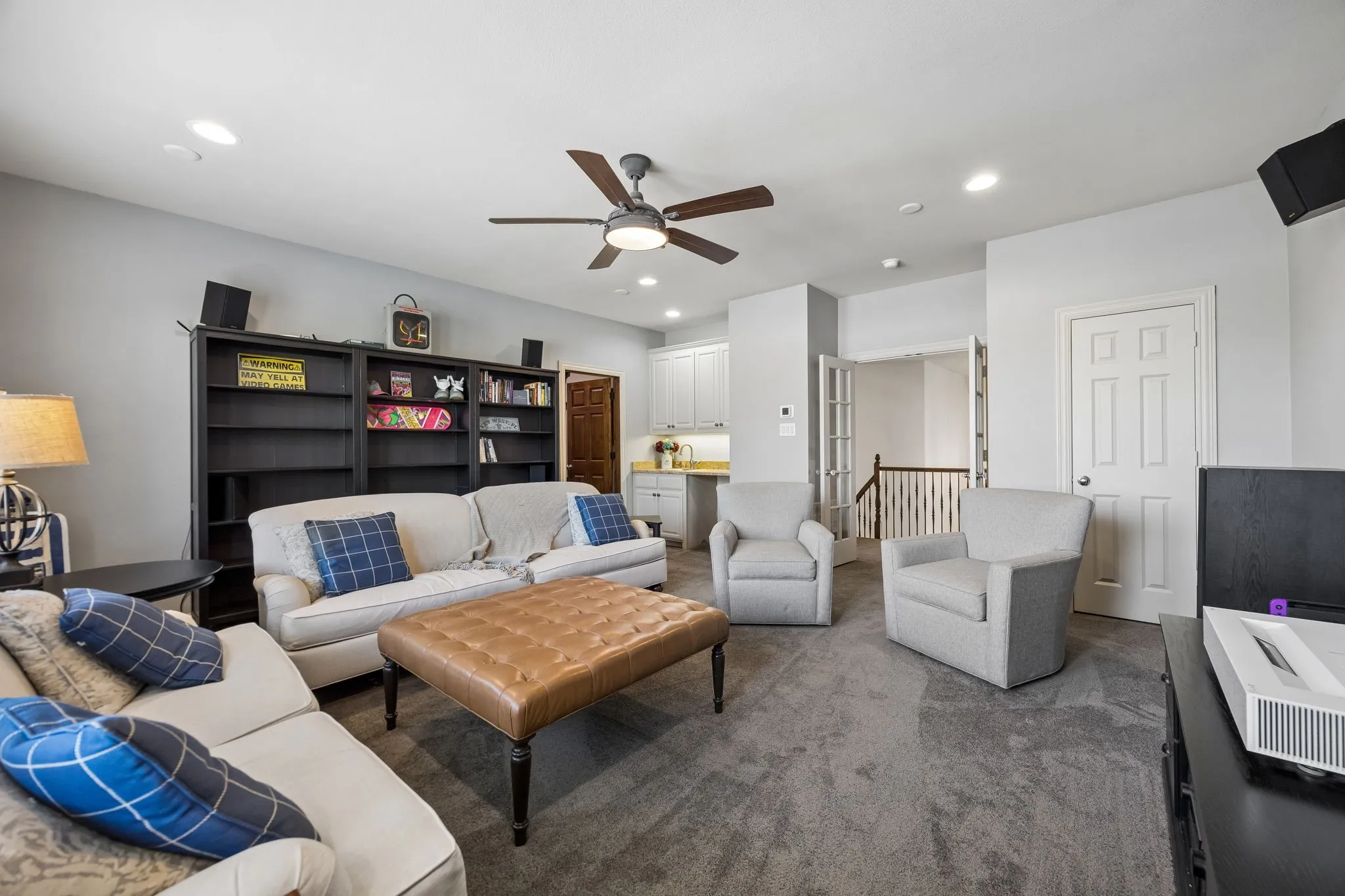 2nd level family room with doors and built in wet bar