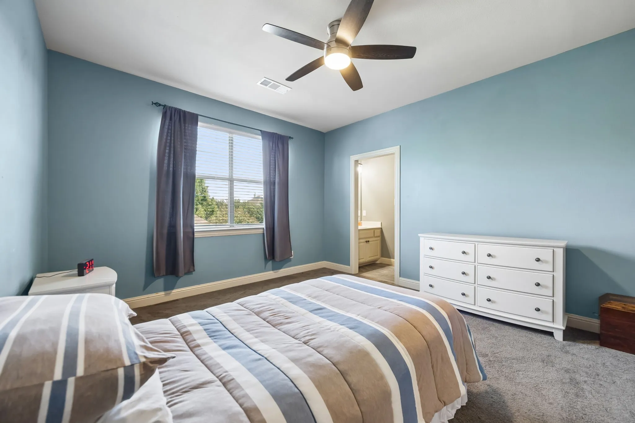 Secondary bedroom connects a Jack N Jill bath. Each room has walk in closets and their own vanities.