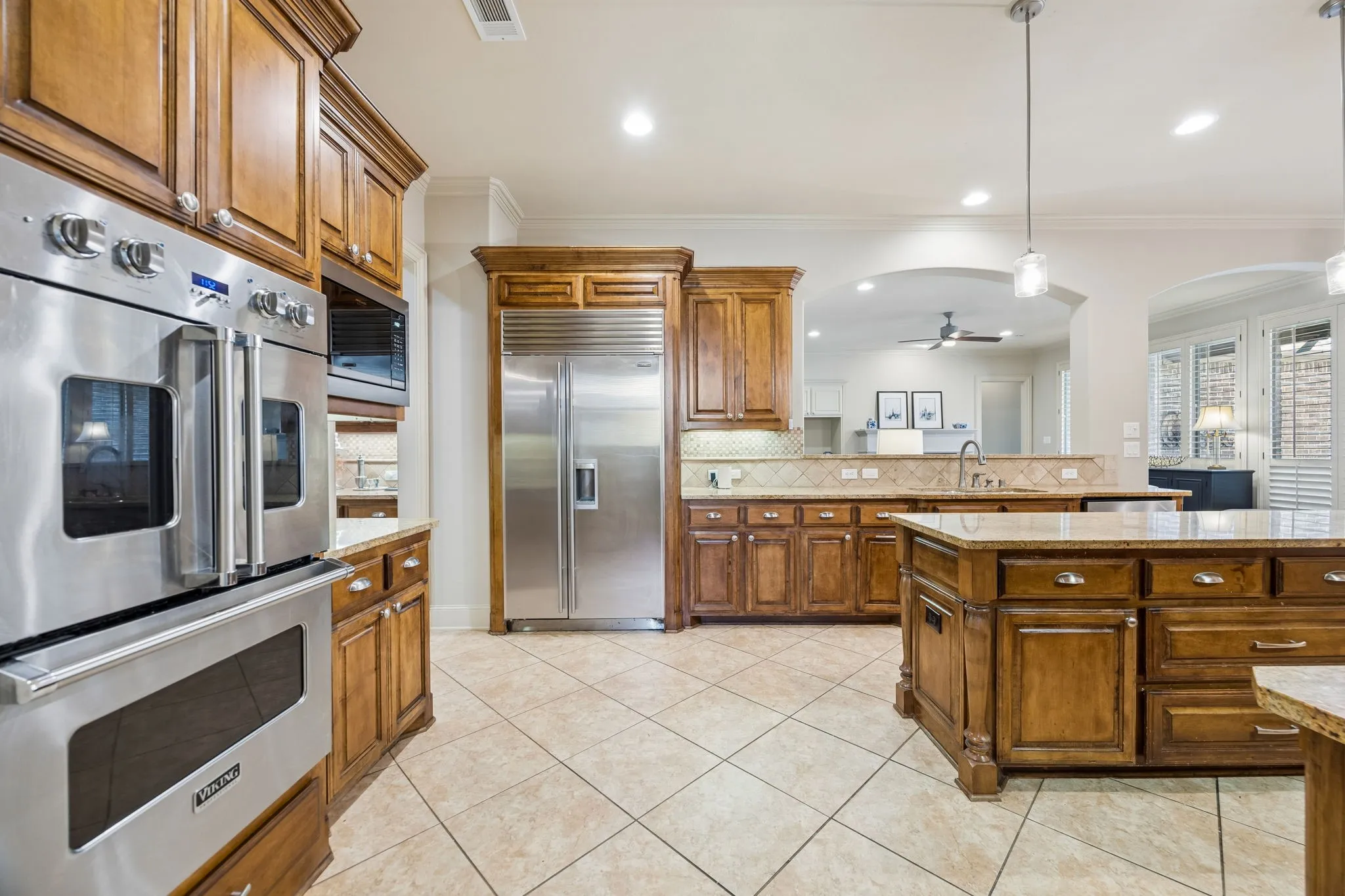 Viking stainless steel double ovens, a built-in microwave, Sub Zero stainless steel refrigerator.