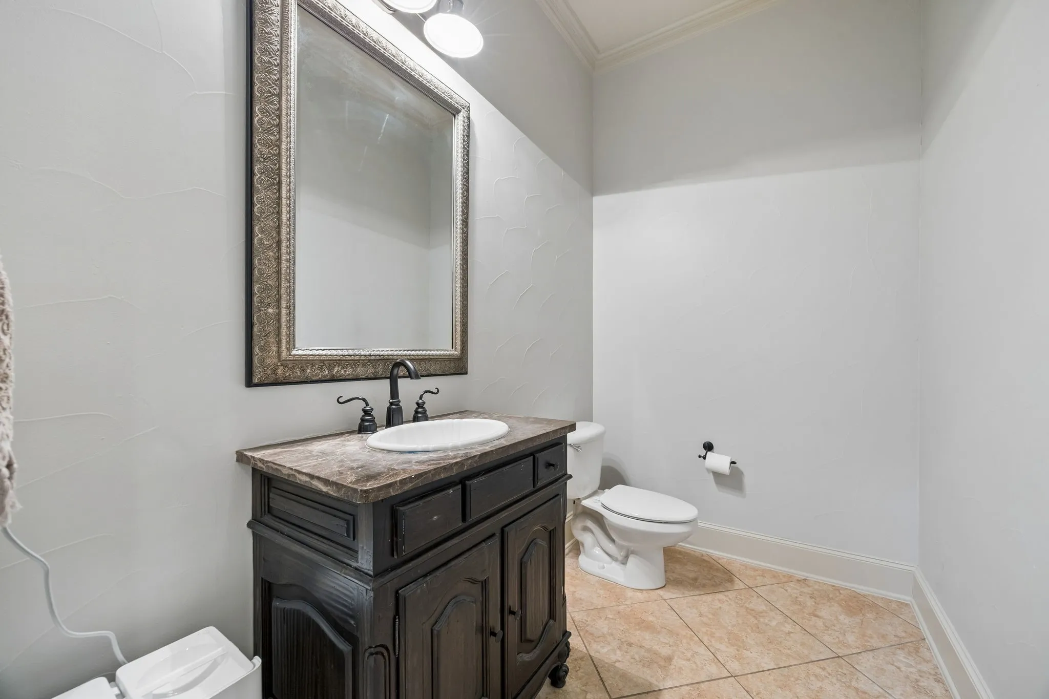 1/2 bath with vanity and framed mirror