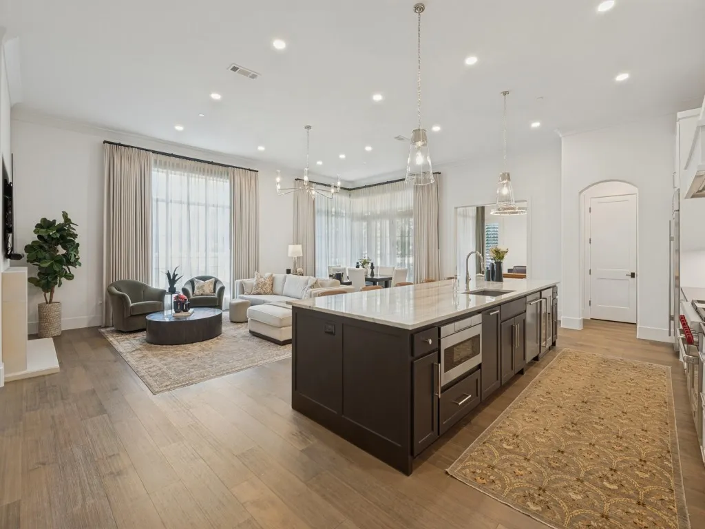 The kitchen island also houses the built-in microwave, and beverage cooler as well as a pull out trash can.