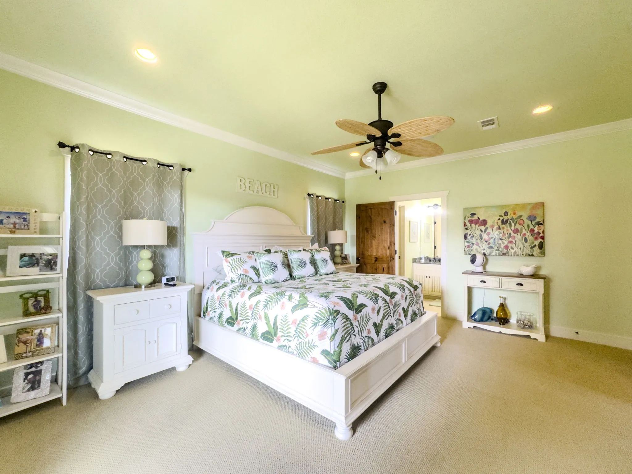 Recessed lighting, crown molding, ceiling fan with light fixture, wood-finish interior door, and carpet flooring