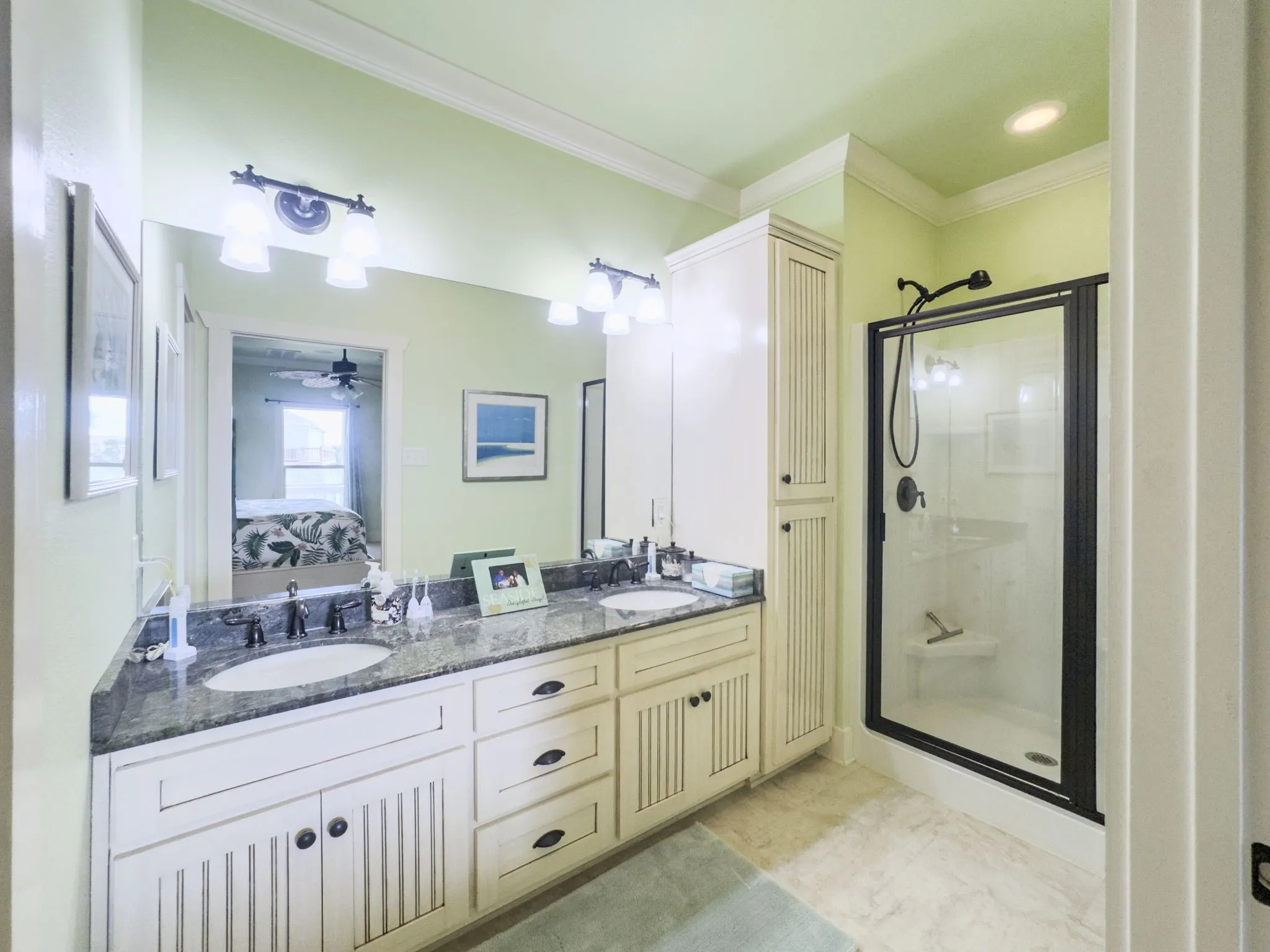 Dual vanity with undermount sinks and dark countertops