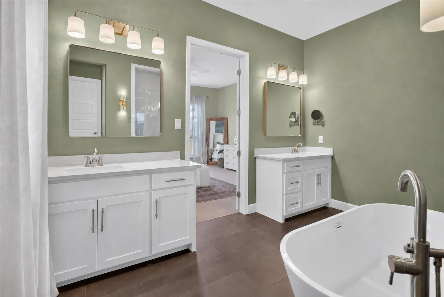 Dual vanity sinks with white cabinetry