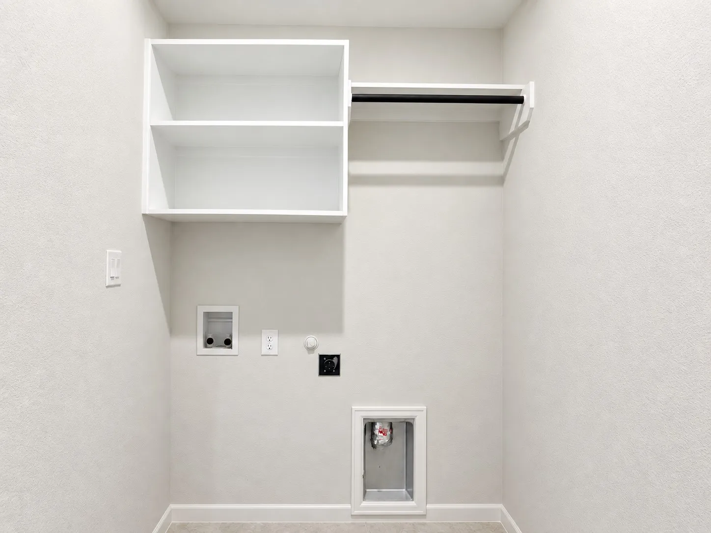 Built-in shelving, hanging rod, and utility hookups