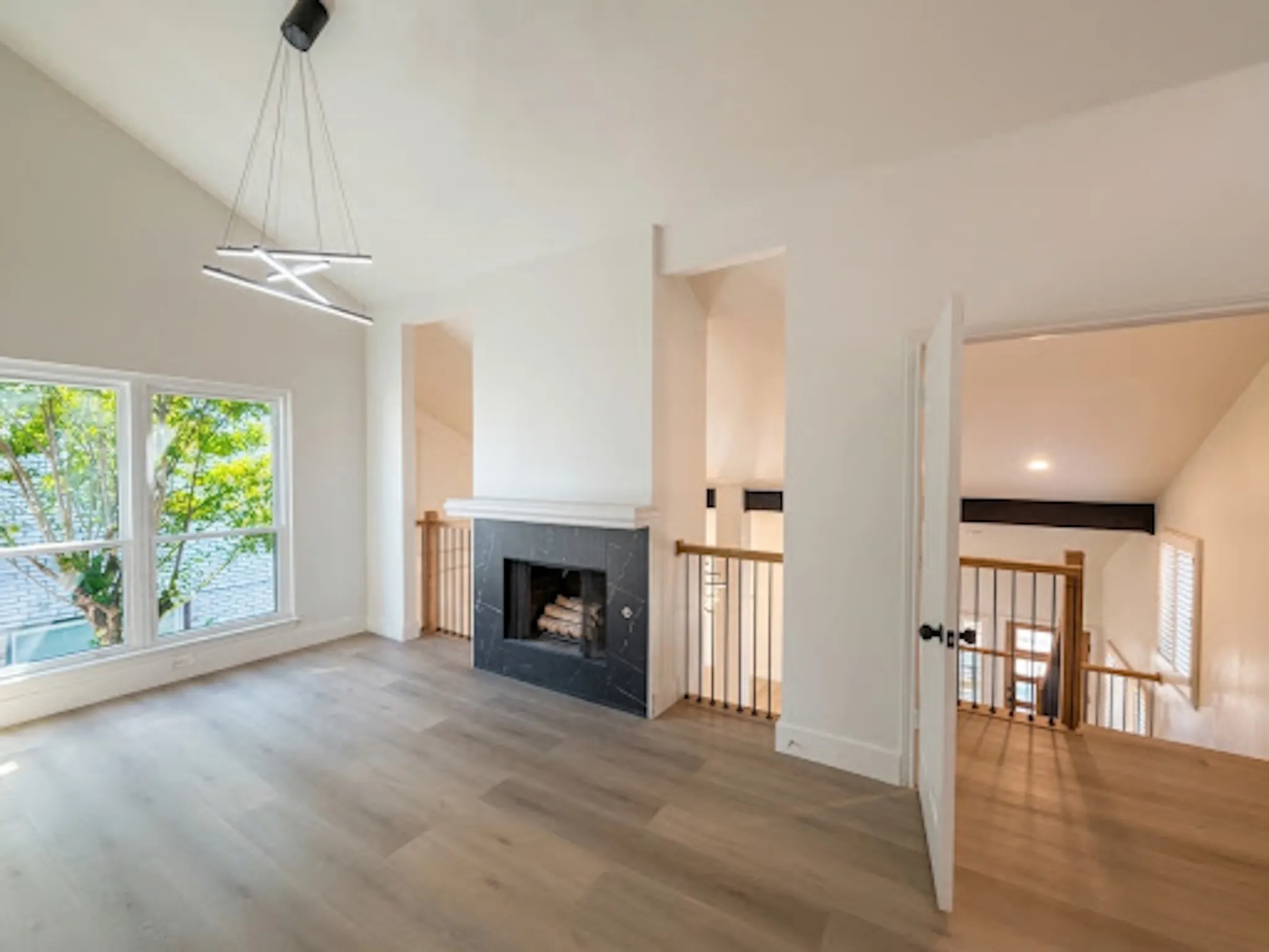 Master bedroom with separate nook with fireplace