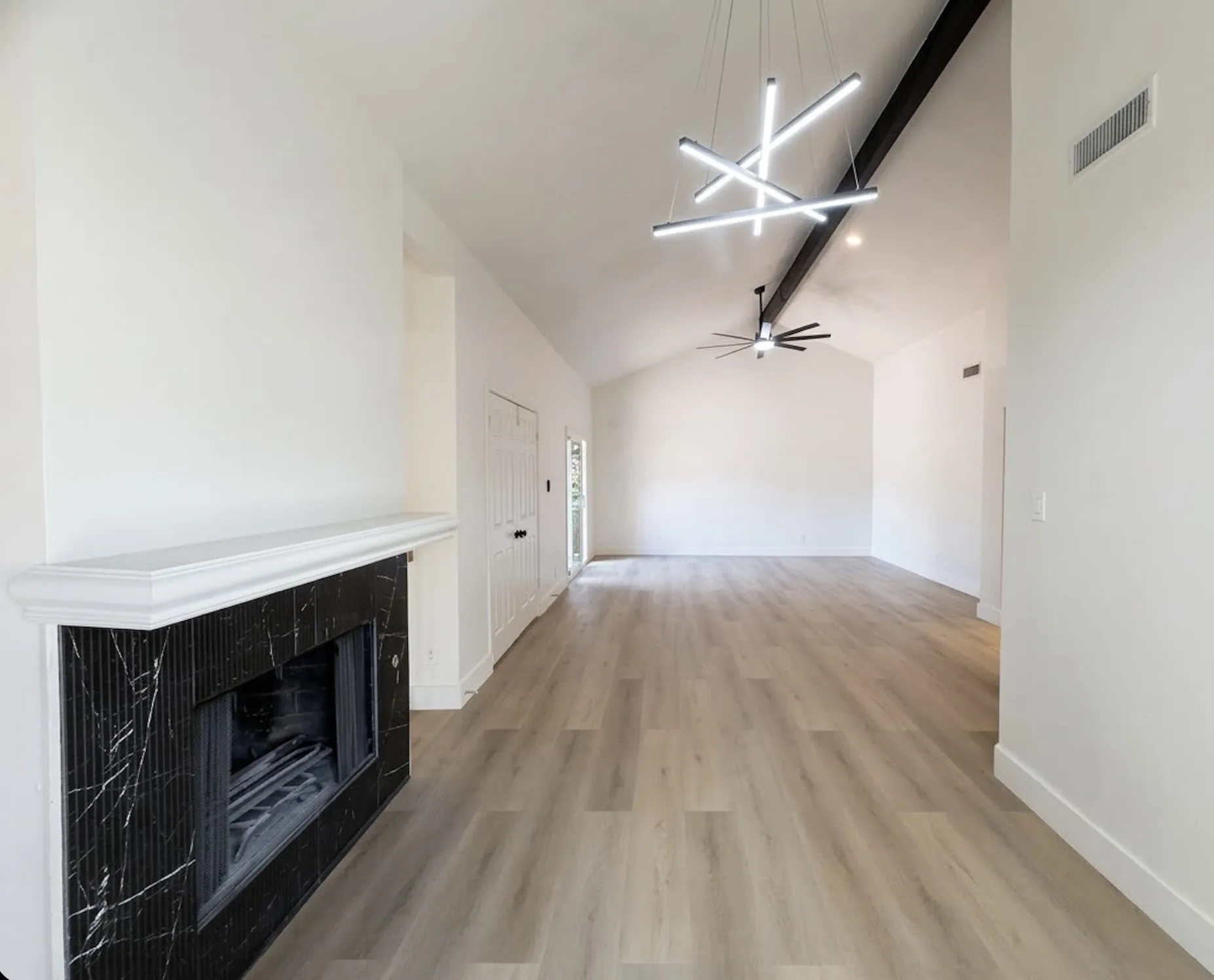 Master bedroom with separate nook with fireplace