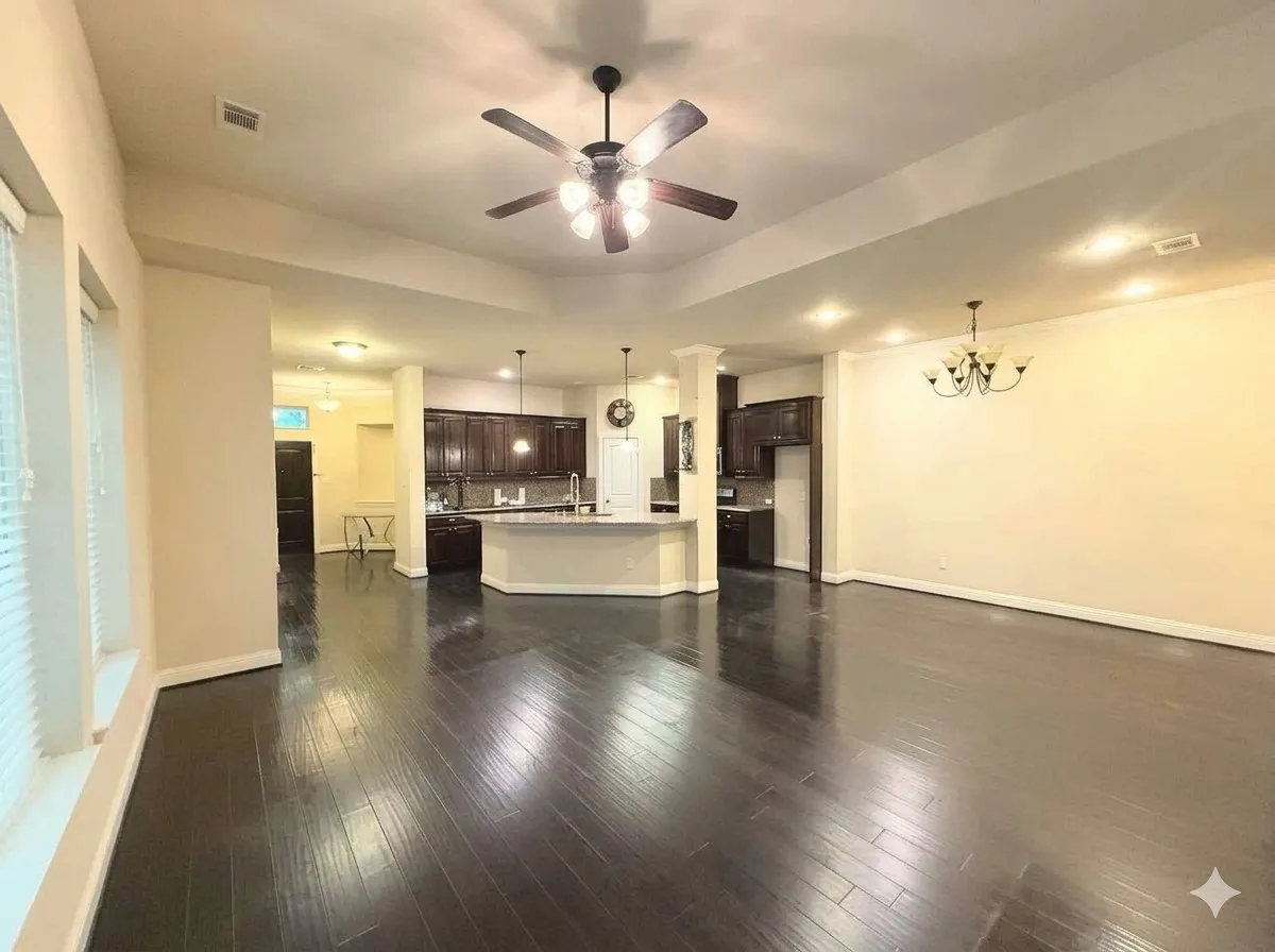 Open-concept living area featuring wood-finish flooring and recessed lighting