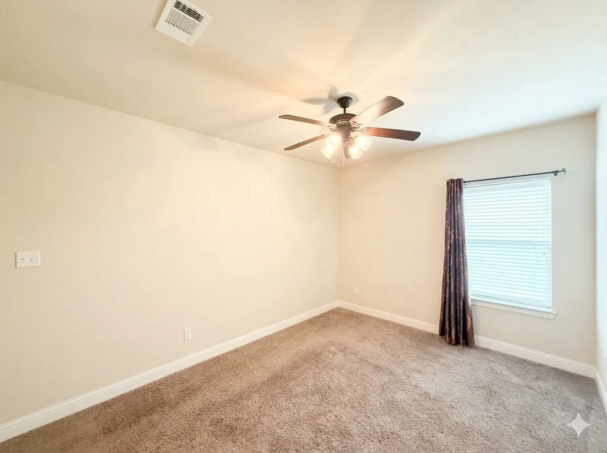 Neutral wall finishes with a ceiling fan light fixture, window with blinds, and carpet flooring