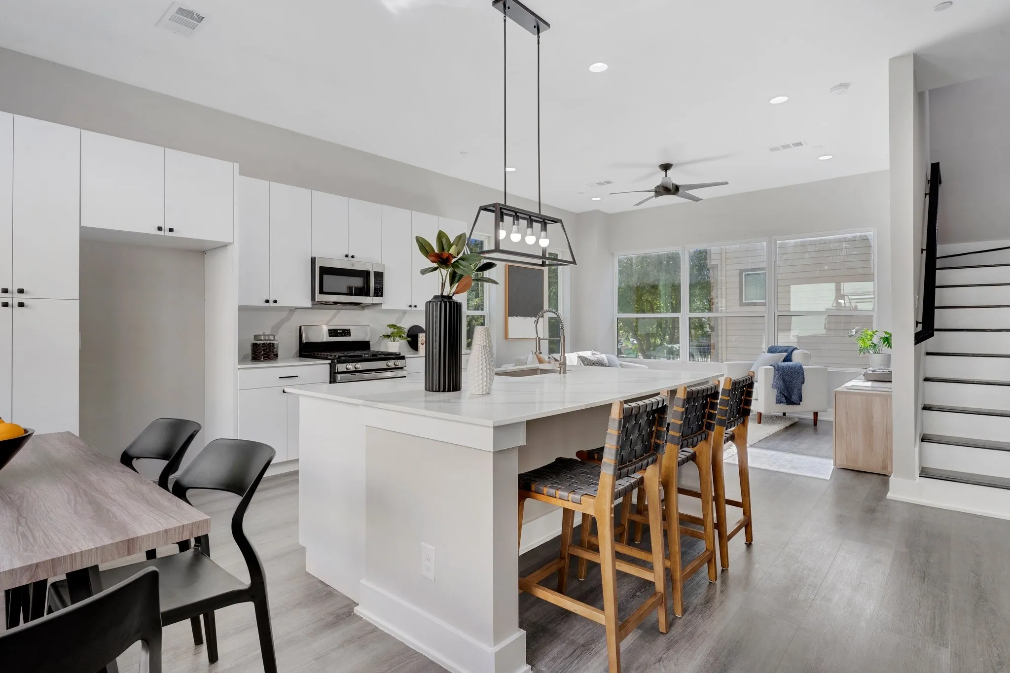 Modern kitchen with white cabinetry and stainless steel appliances