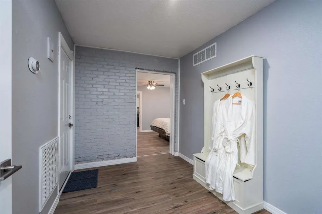 Wood-finish flooring throughout the space