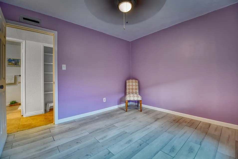 Light wood-finish plank flooring throughout