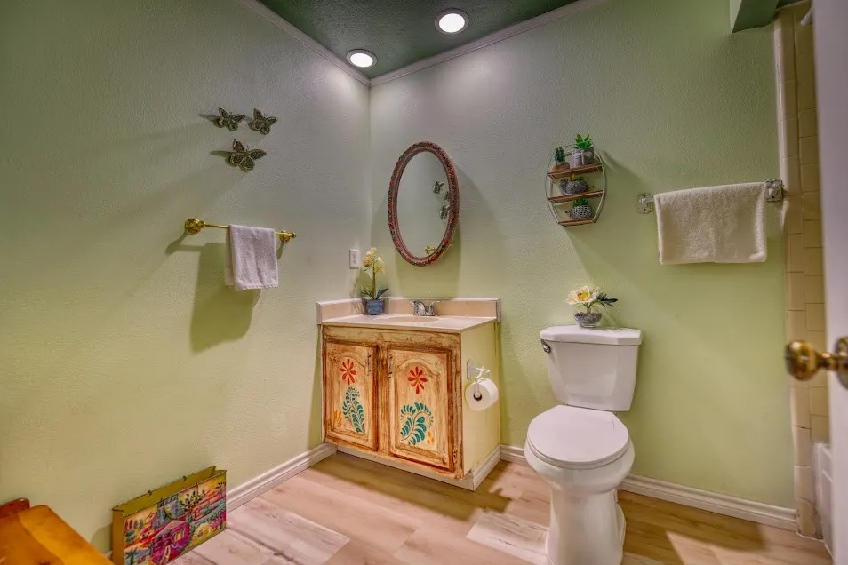 Wood-finish flooring with baseboard trim