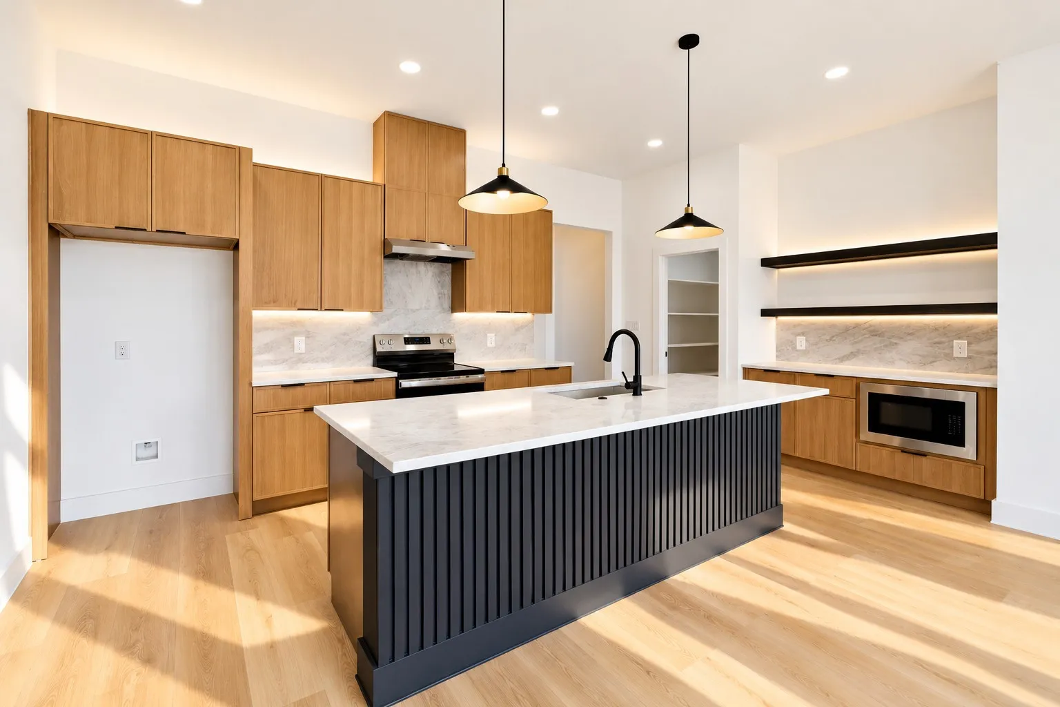 Kitchen featuring wood-finish cabinetry, a large central island with a white countertop, stainless steel appliances, and wood-finish flooring