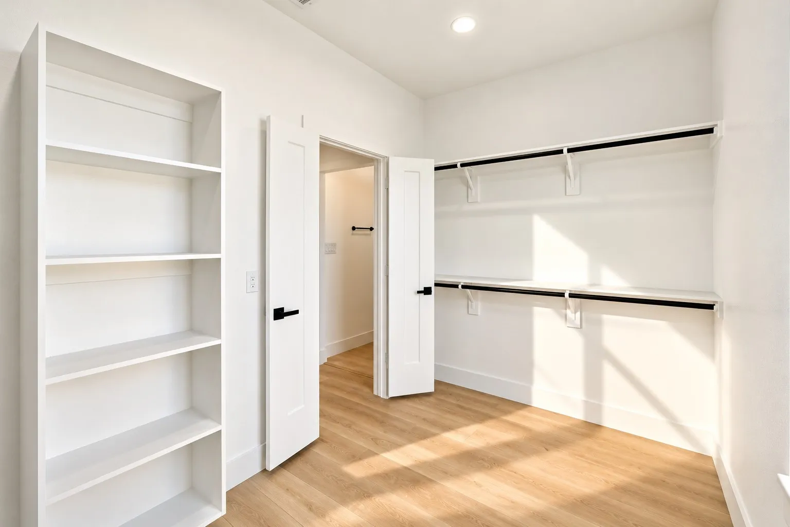 Built-in open shelving, wood-finish flooring, recessed ceiling lighting, and a closet with shelving and hanging rods