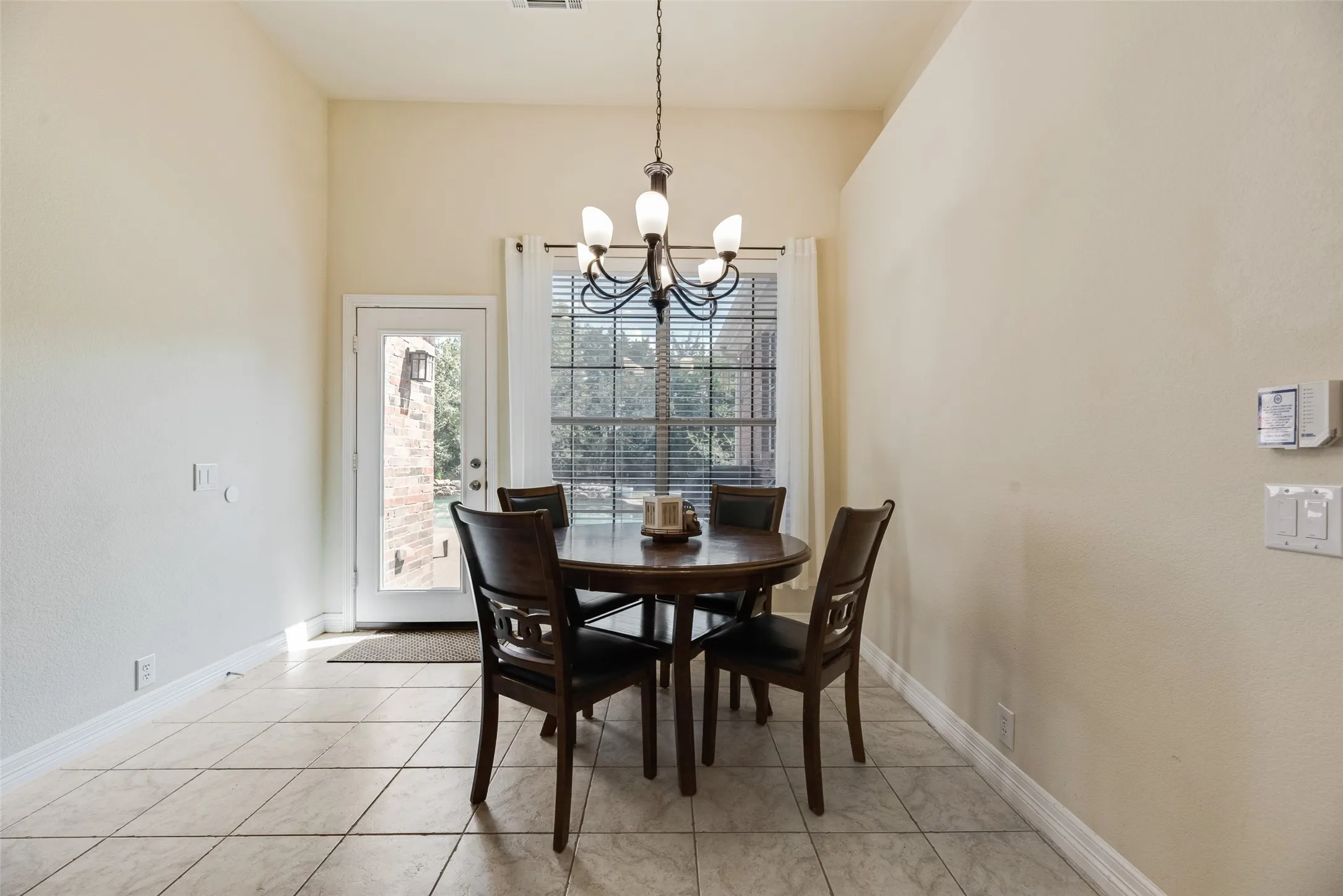 Tiled flooring complemented by a tall ceiling