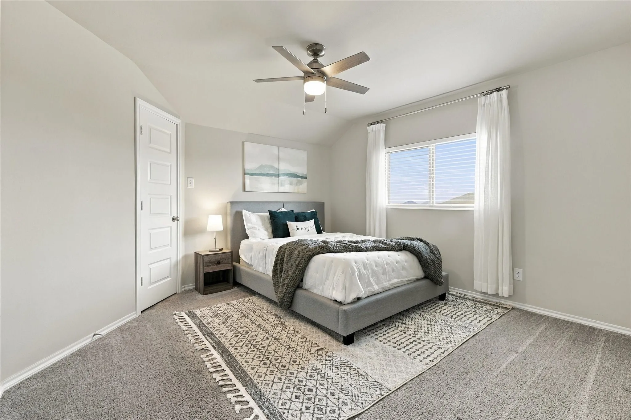 Recessed window with blinds, paneled door, ceiling fan with integrated lighting, and neutral wall color