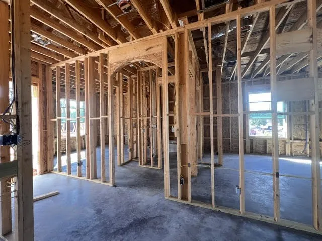 Standing in the living area looking toward the two guest bedrooms and bath room