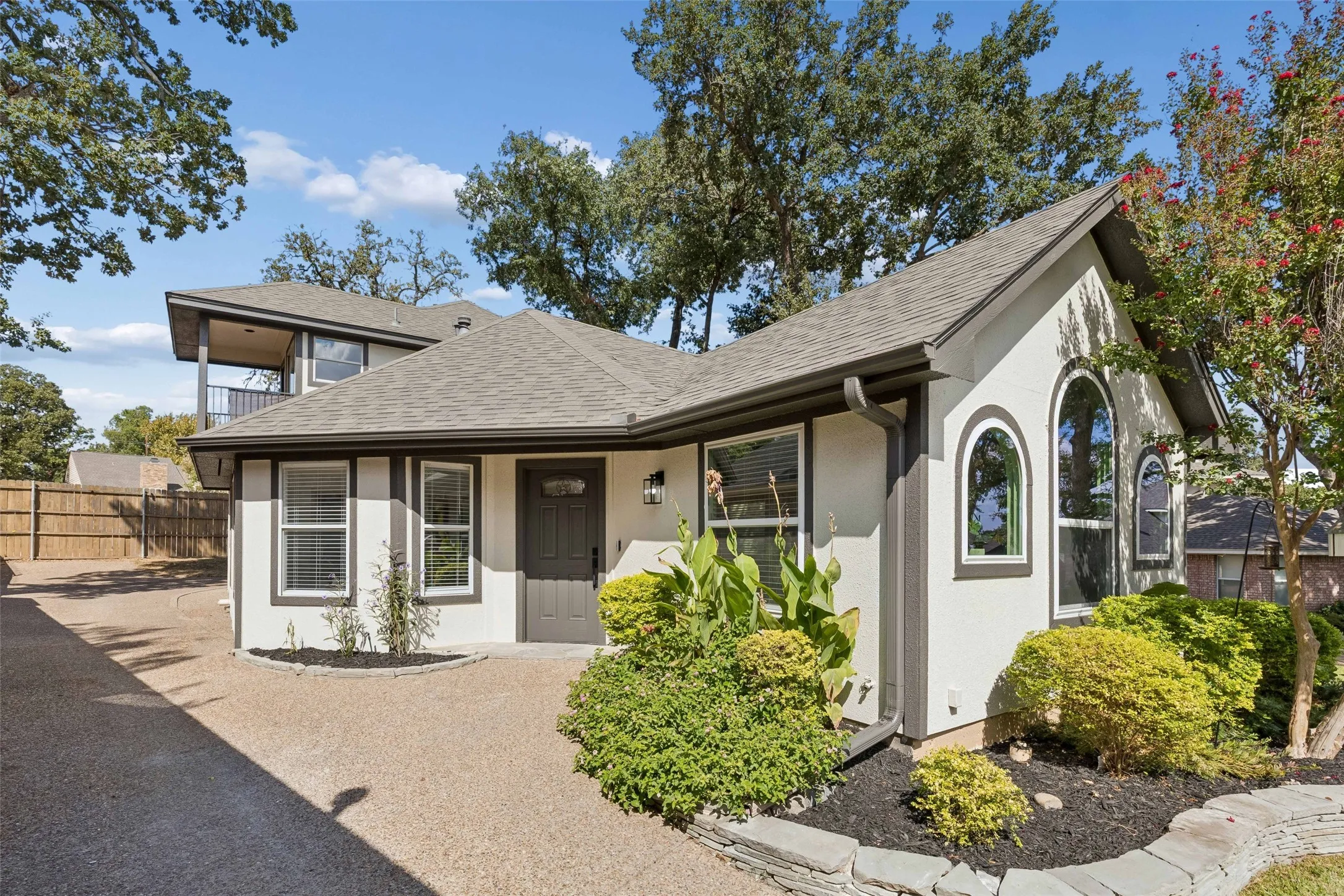 Stucco exterior with dark trim accents