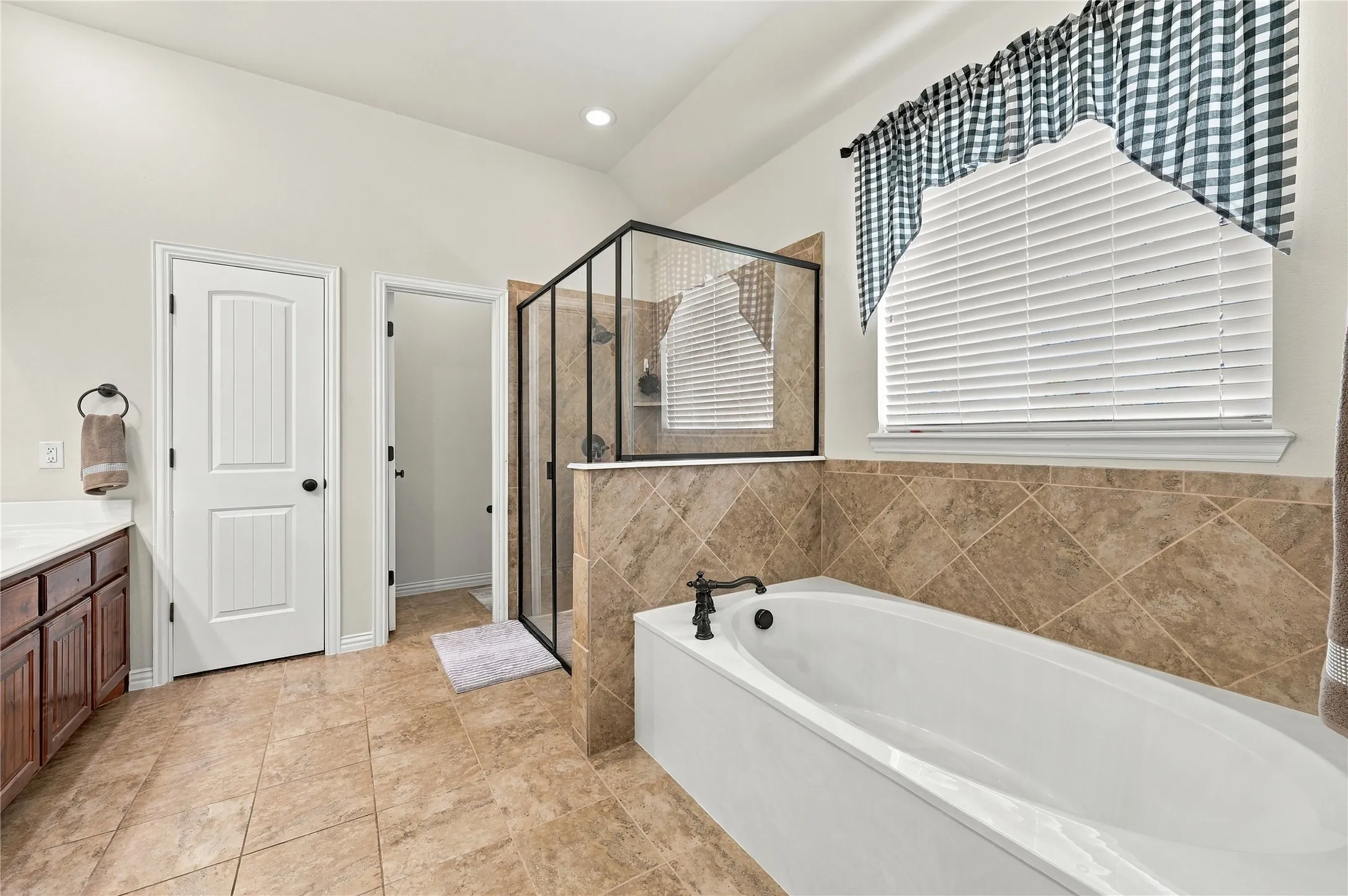 Primary bathroom with separate tub and shower