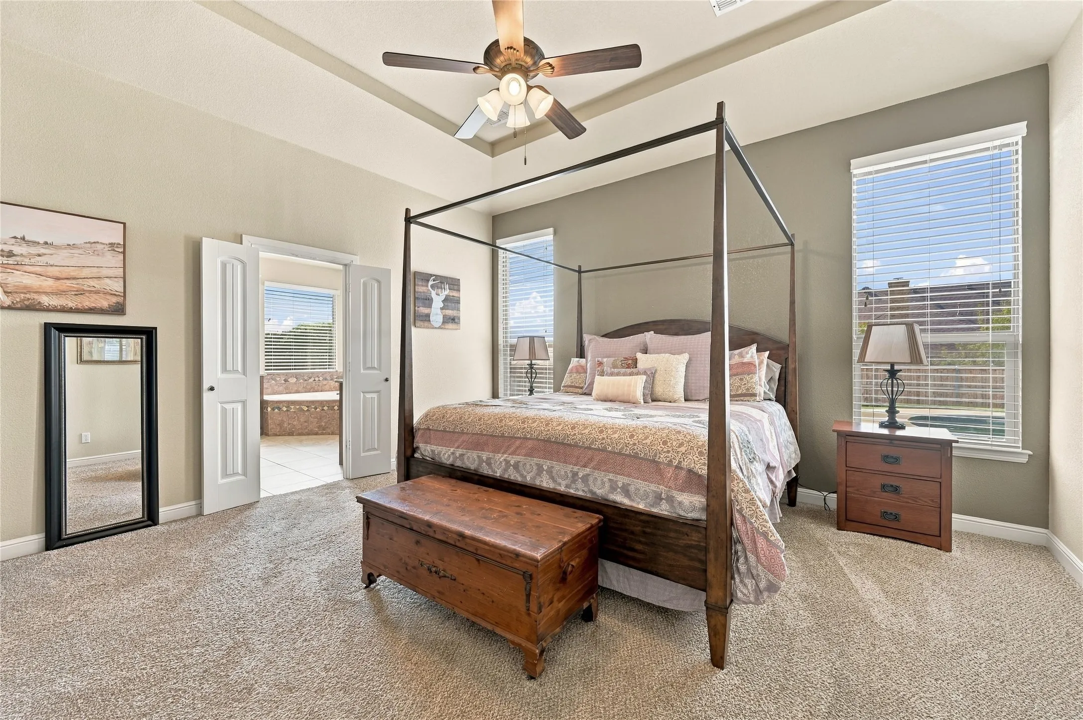 Primary bedroom with view of pool