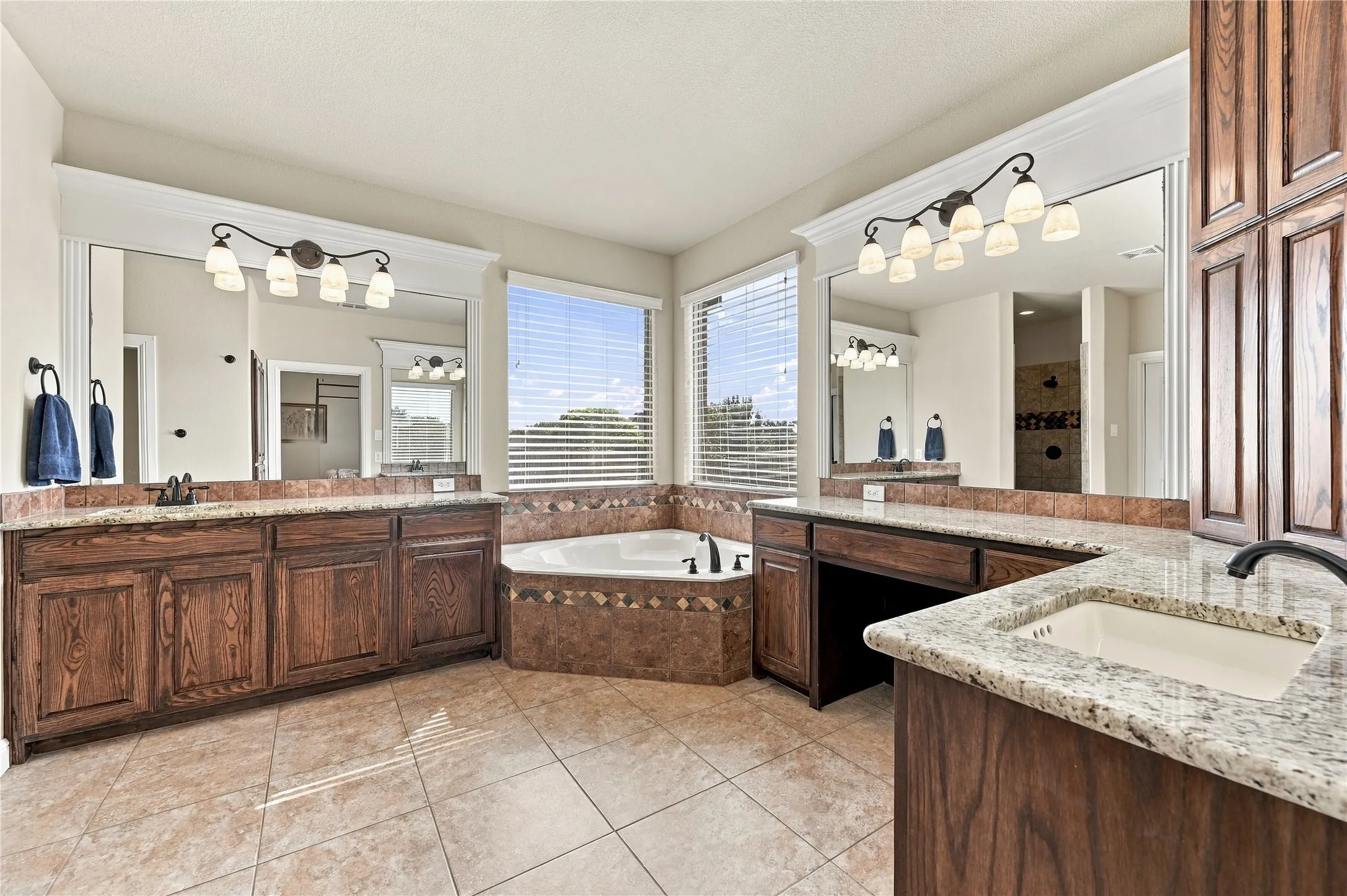 Primary bathroom with separate vanities