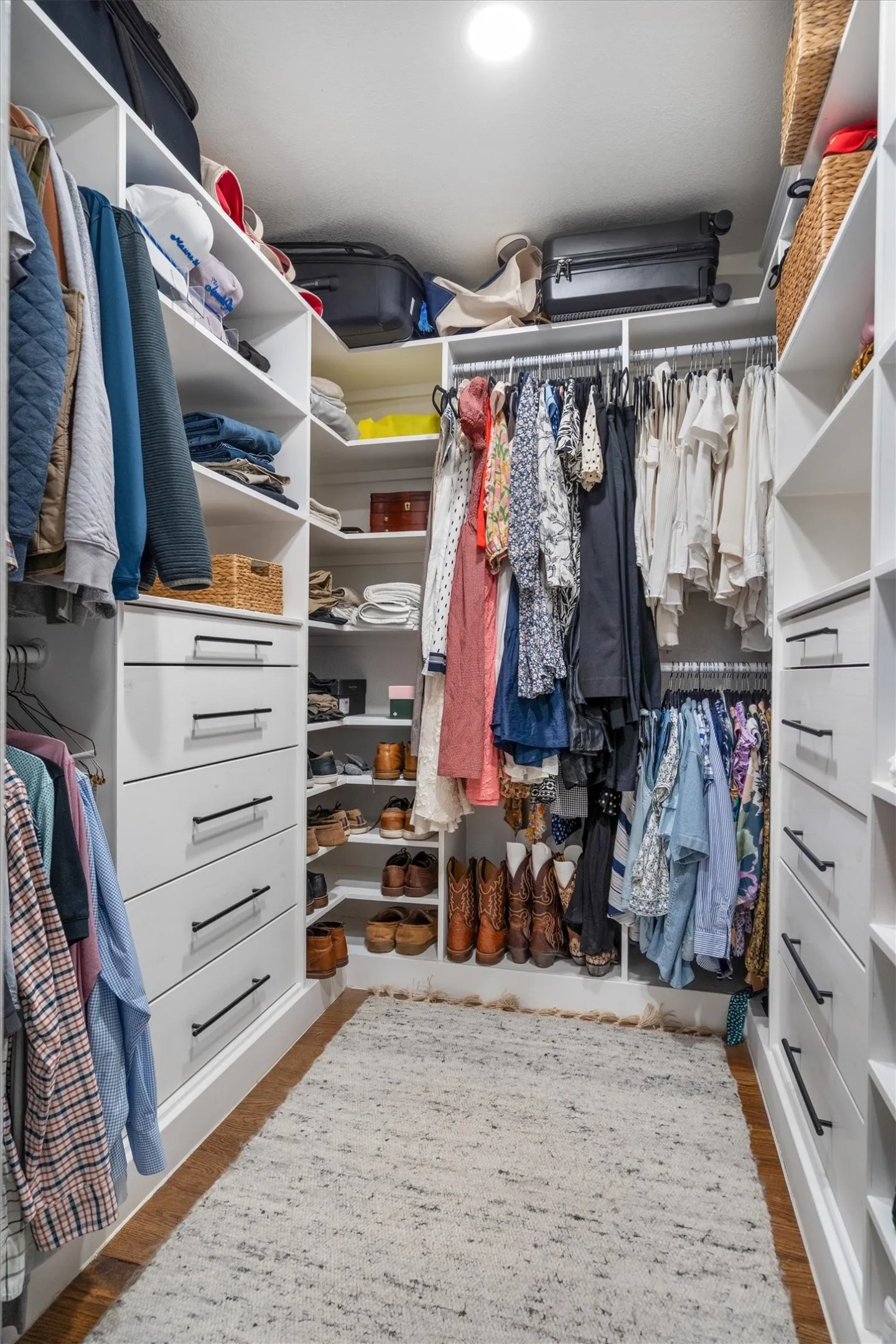 Custom closet system in the primary bedroom.
