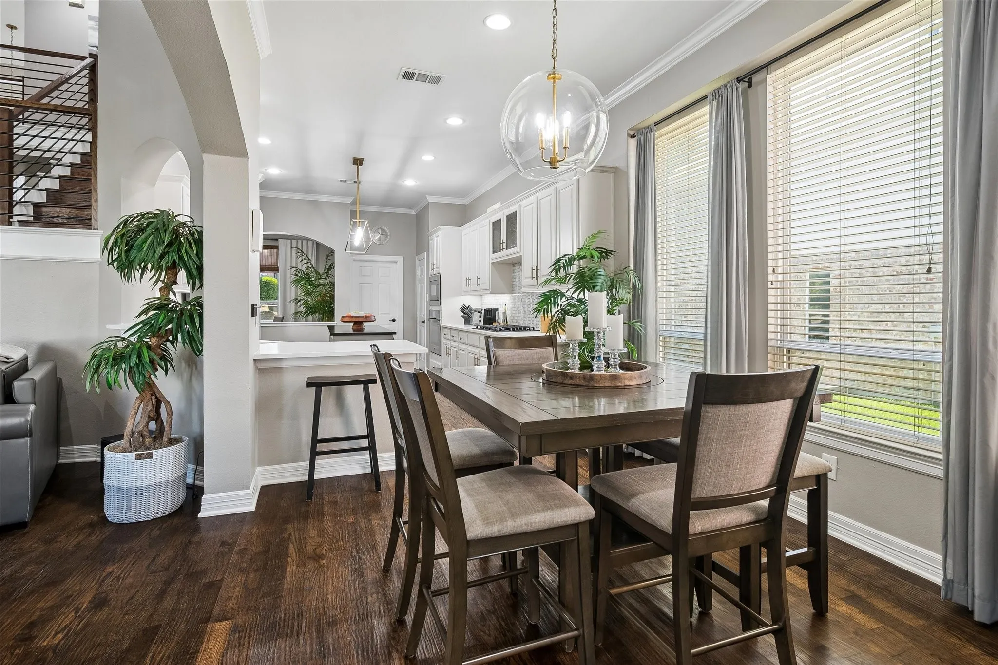 Hardwood-finish flooring, recessed lighting, and crown molding