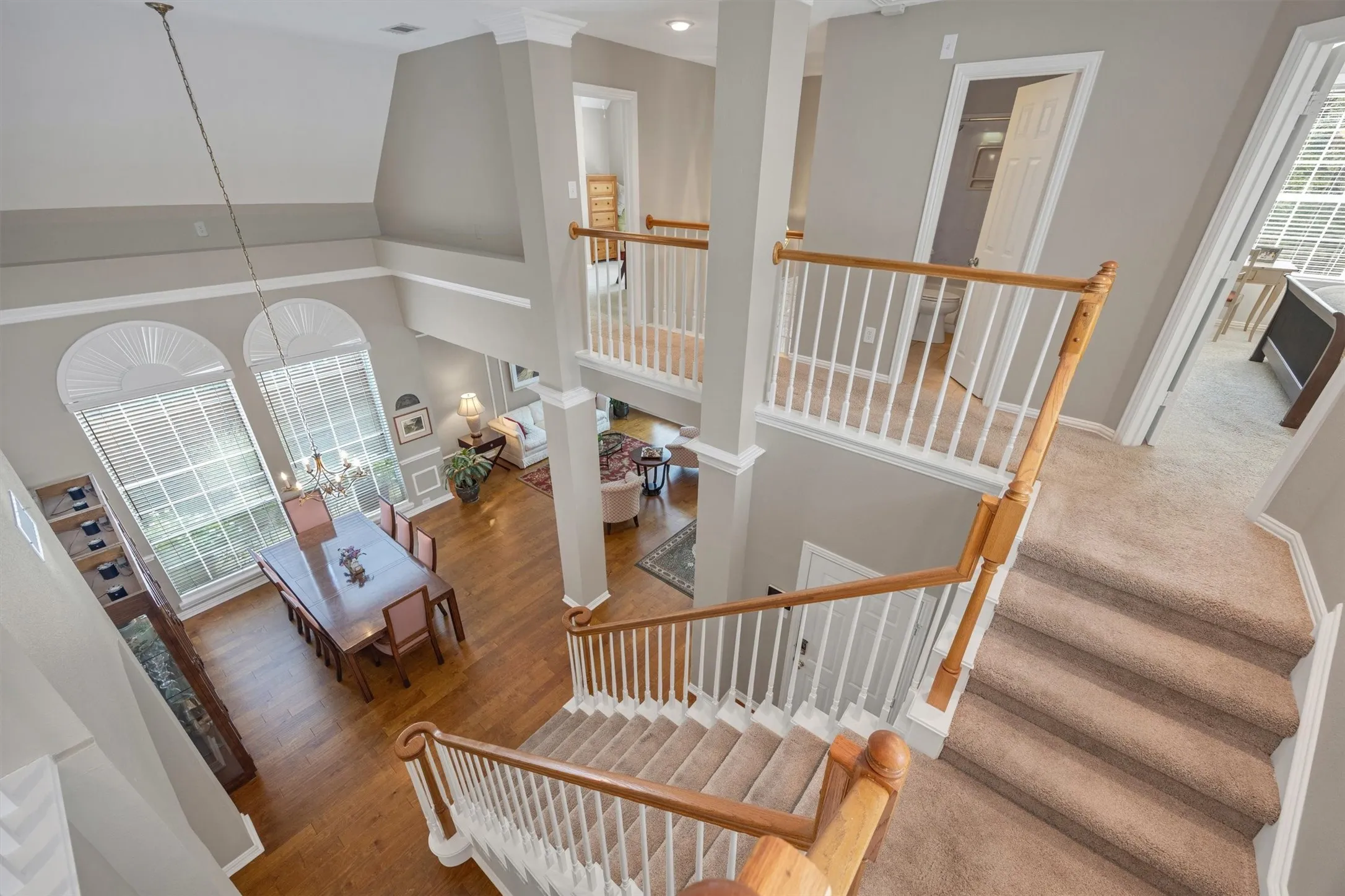 View taken from the loft. Catwalk hallway across the front half of the house overlooks the foyer and formals.