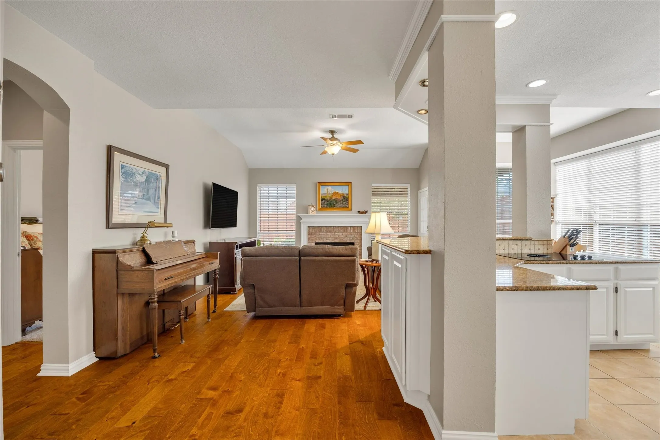 Open concept in the back of the house where the kitchen-nook-den overlook the backyard