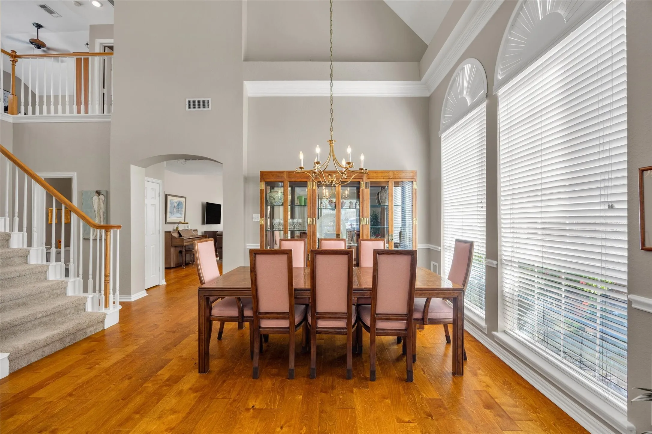 The dining room is 12-ft wide which is big enough for an 8-seat table & hutch.