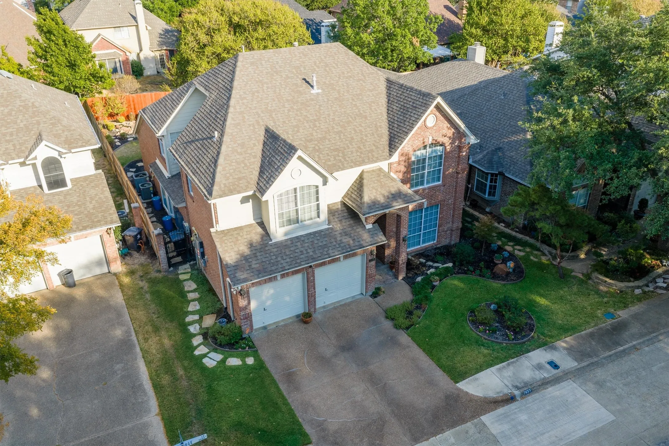 Second house from the end of the street with extra parking lot directly across from the driveway.