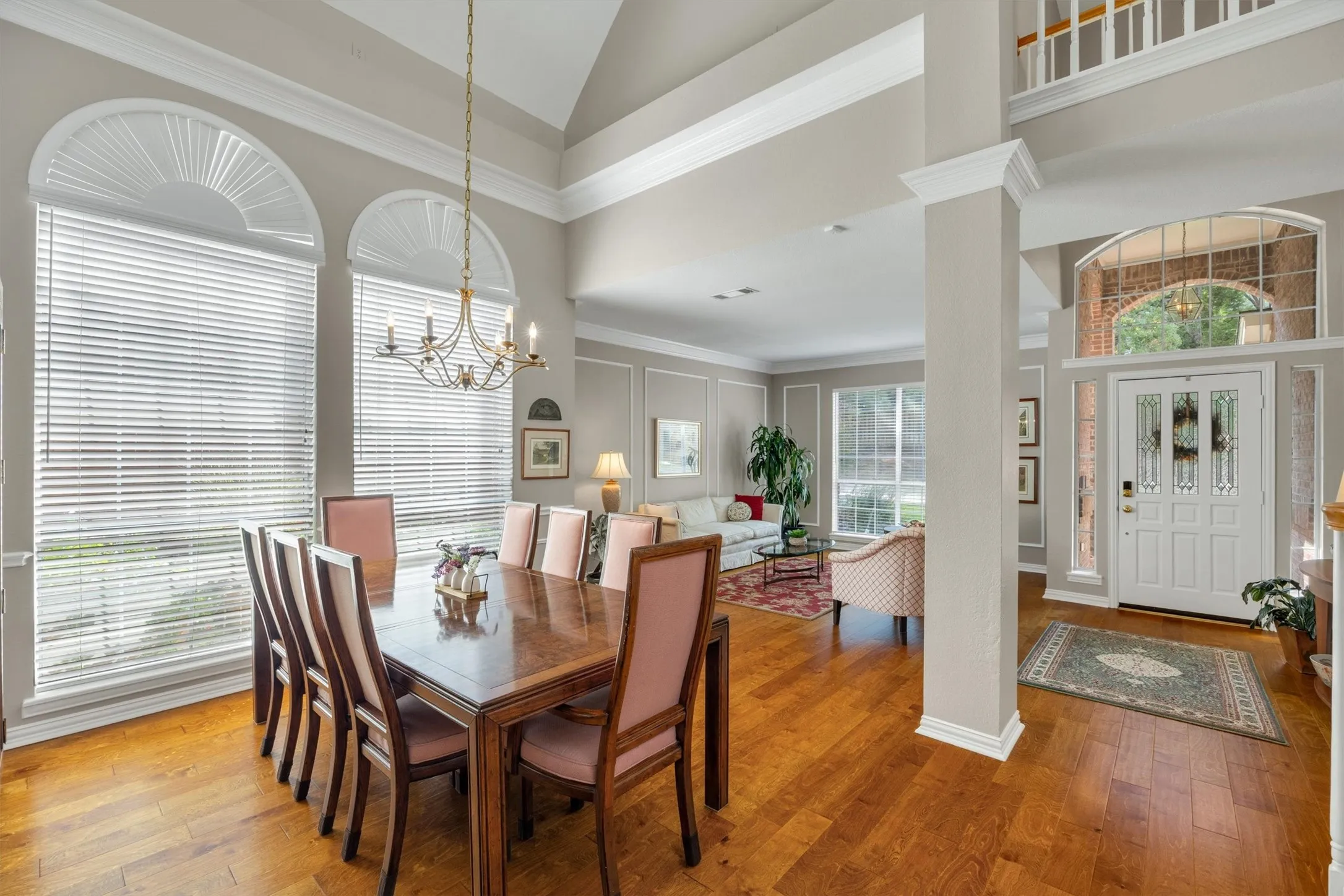 Formal dining room with cathedral ceiling and arched windows bring of lots of natural light!