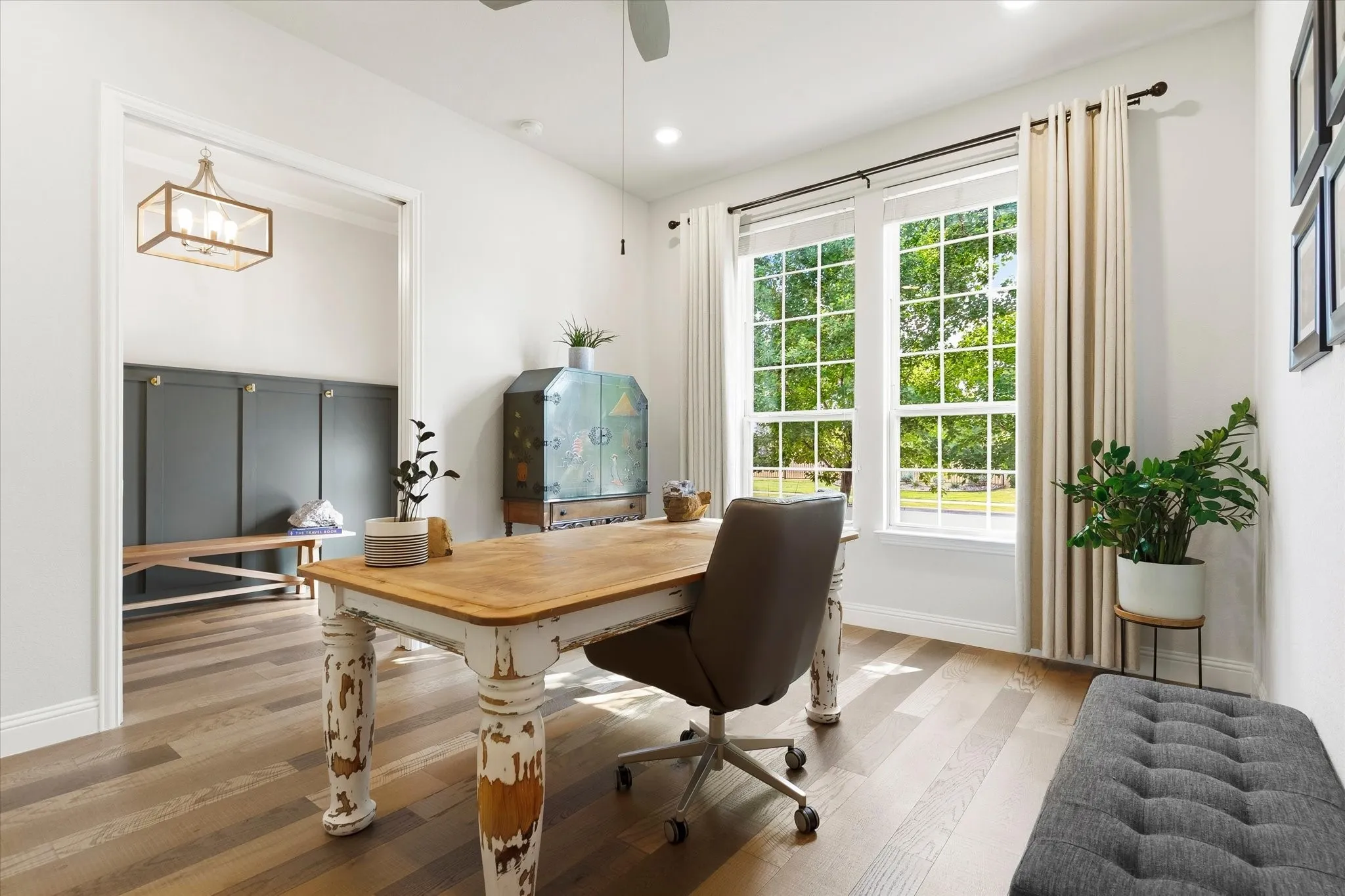 Wood-finish flooring throughout, recessed lighting, and a ceiling fan